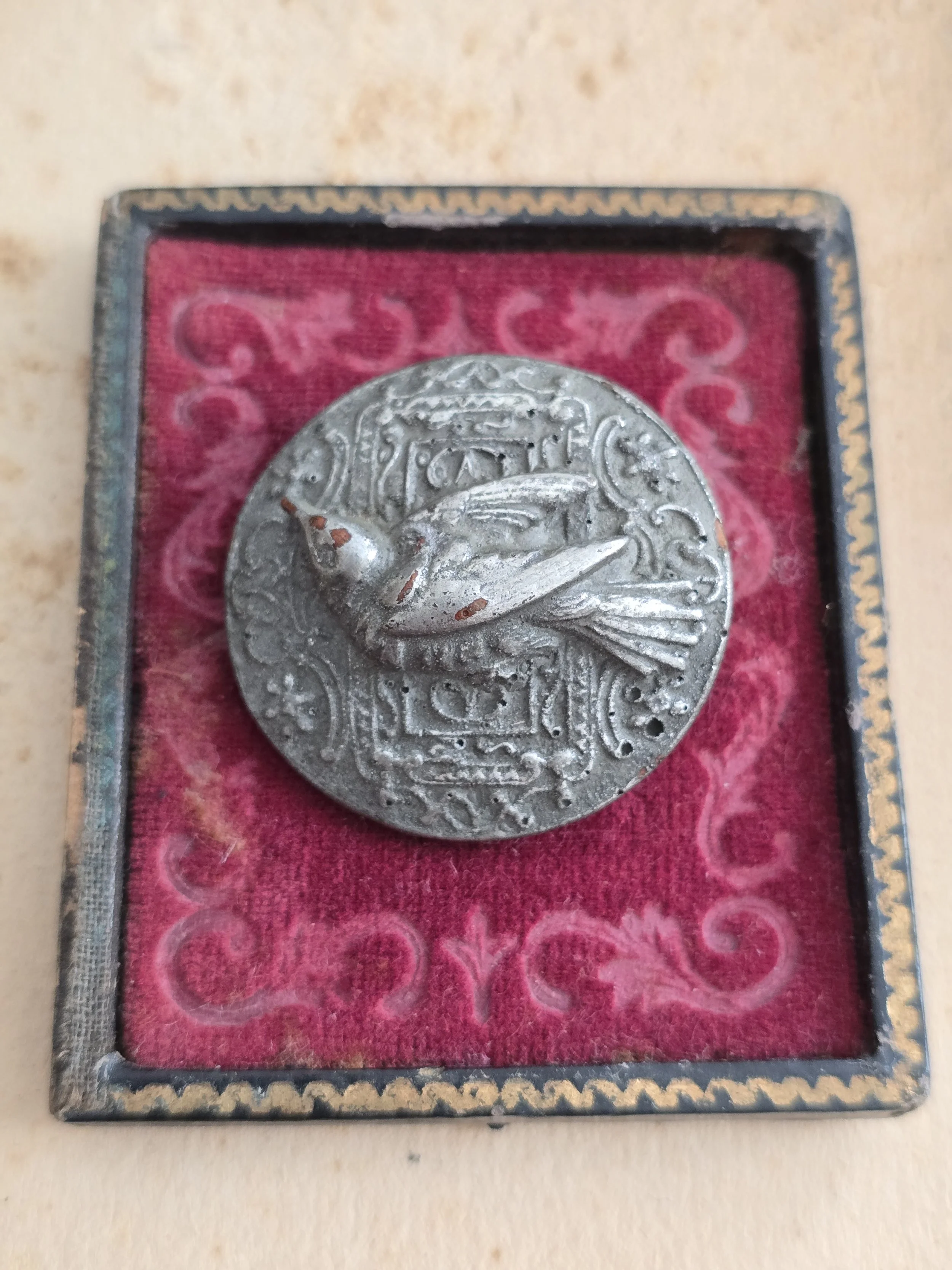 antique bird button converted into a handmade vintage brooch