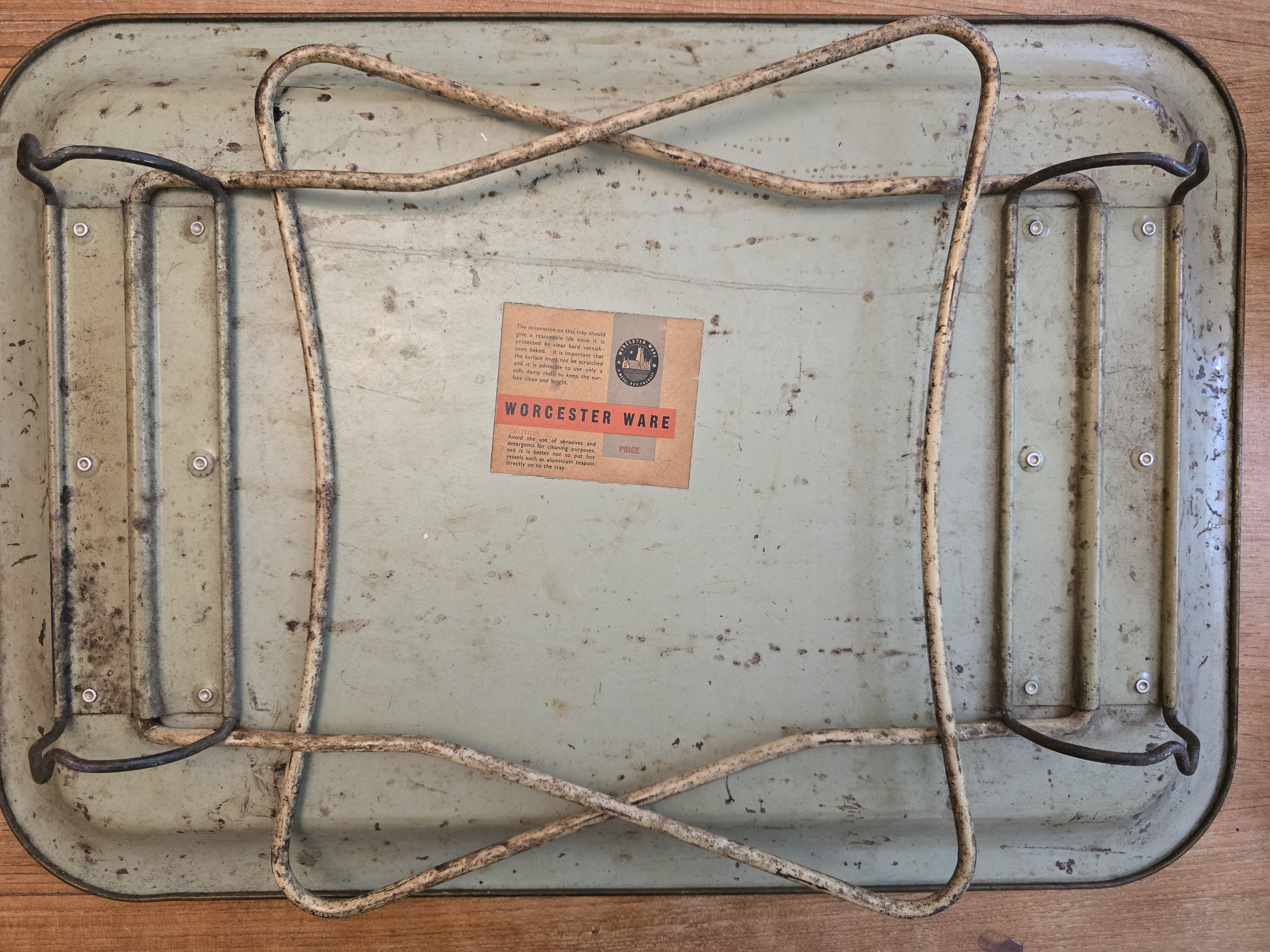 Blue and cream flower detail on antique-style metal tray with distressed cottagecore aesthetic. (Copy)