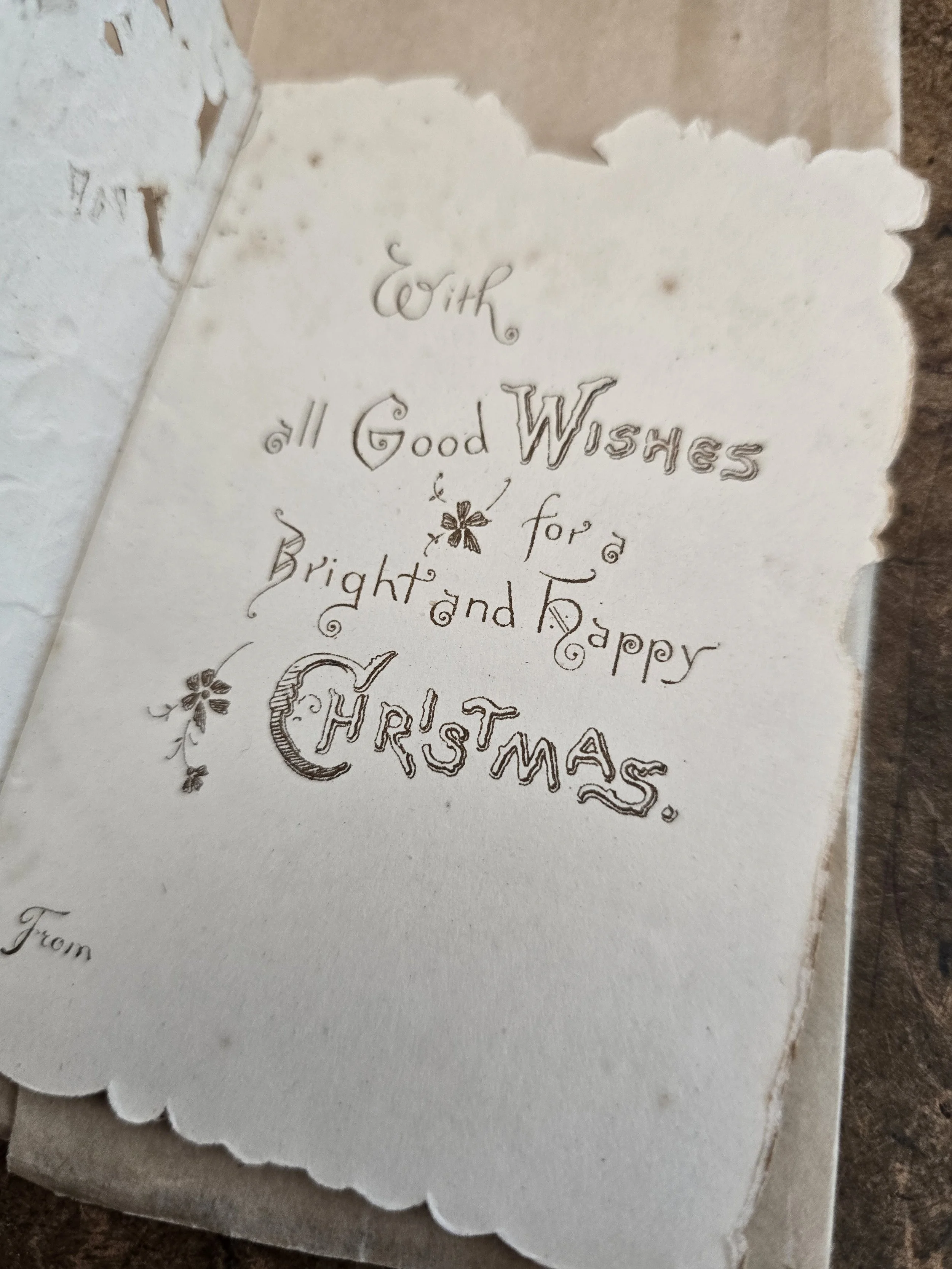 Interior greeting reading "With all Good Wishes for a Bright and Happy Christmas"
