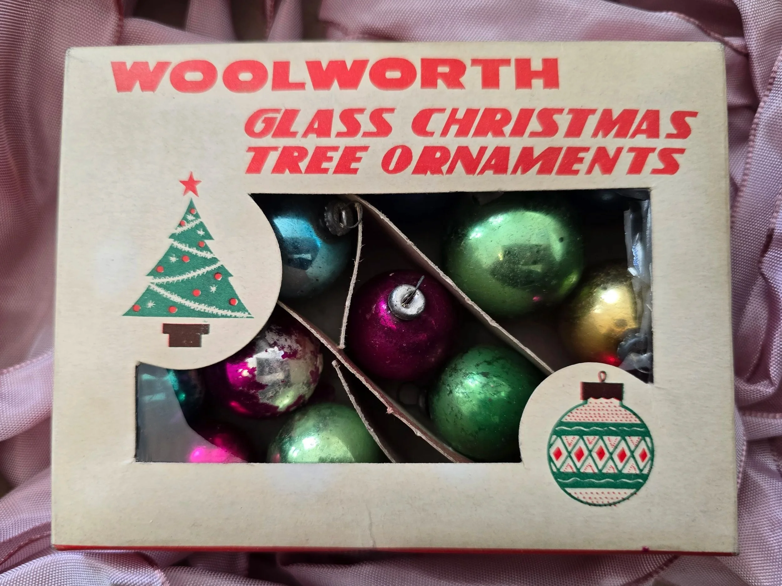 Original Woolworth Glass Christmas Tree Ornaments box with red lettering, illustrated Christmas tree and colourful vintage baubles visible inside.