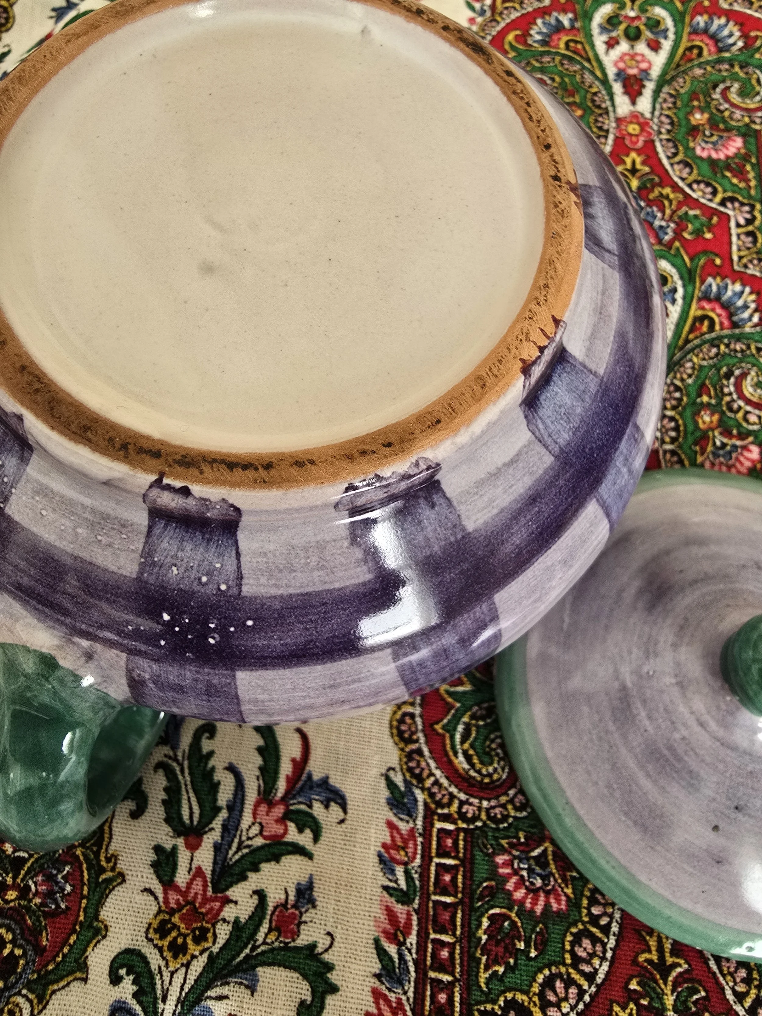 Underside base of Italian ceramic sugar bowl showing unglazed rim
