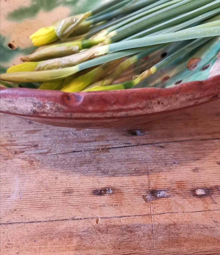 Side view of 1930s terracotta gresal bowl with timeworn glaze.