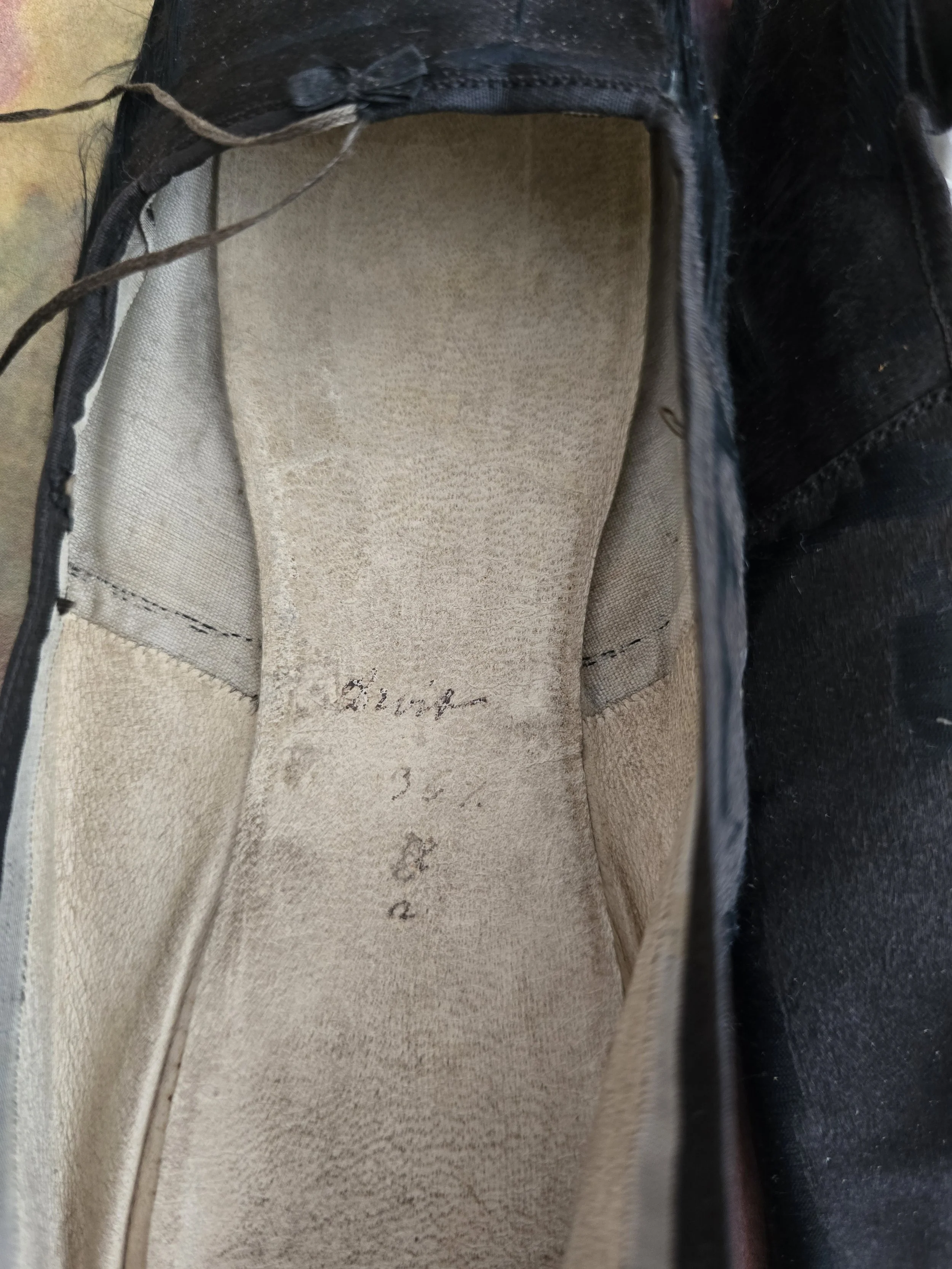 Interior construction of antique French satin slippers.