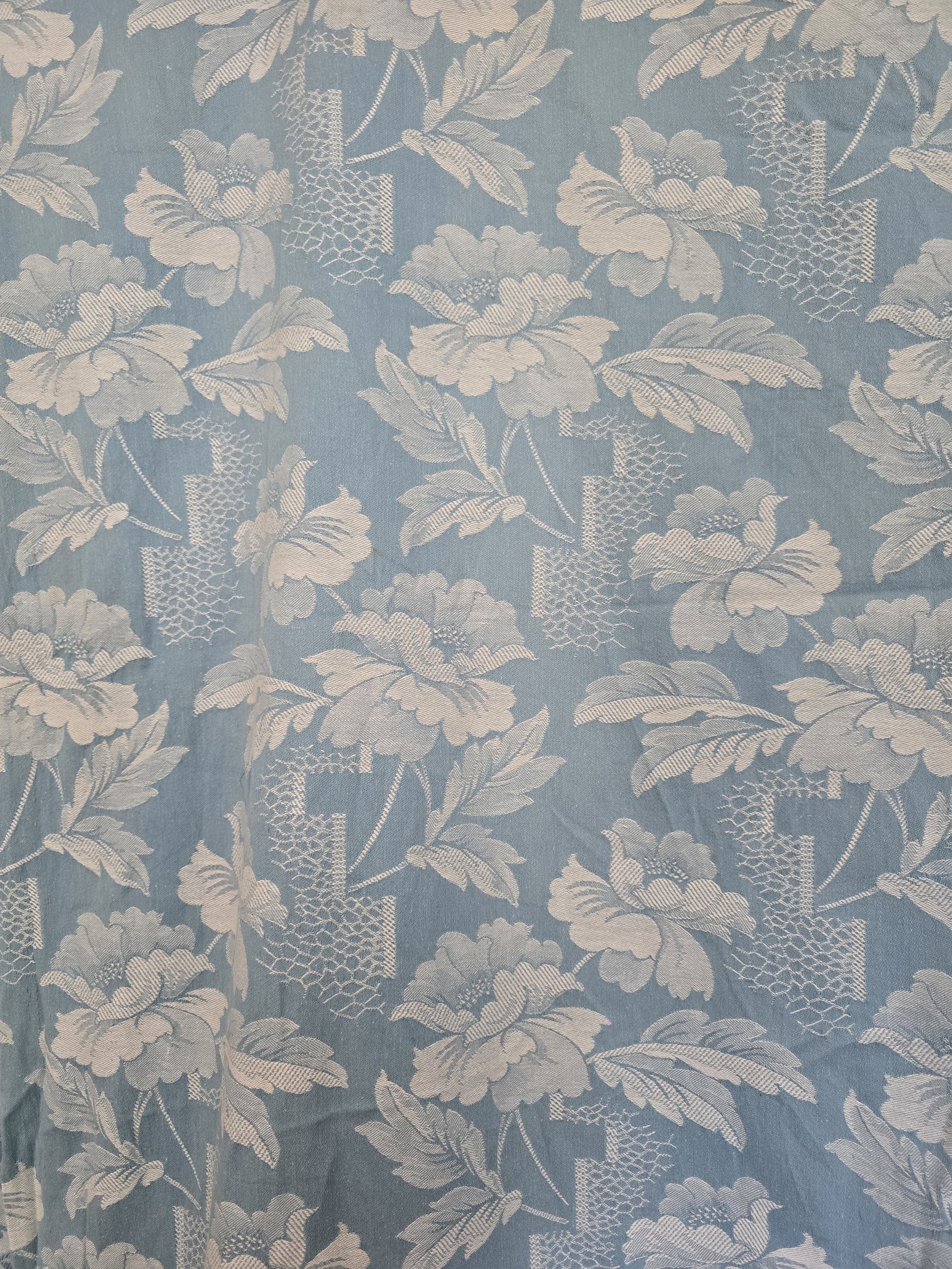 Full repeat of vintage French floral coutil fabric with blue botanical motifs