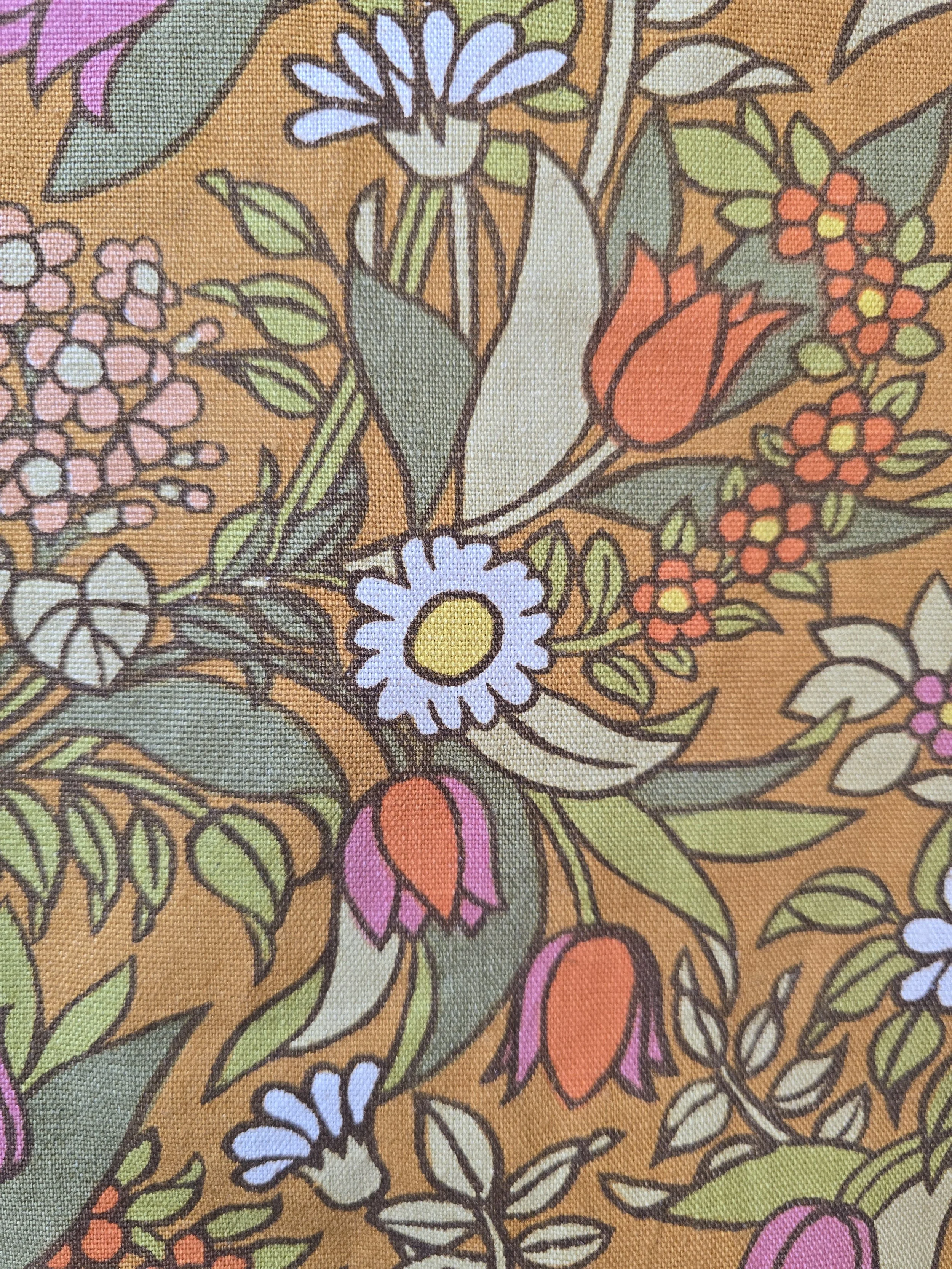 Vintage Jonelle Flower Waltz fabric with colourful flowers on an ochre background.