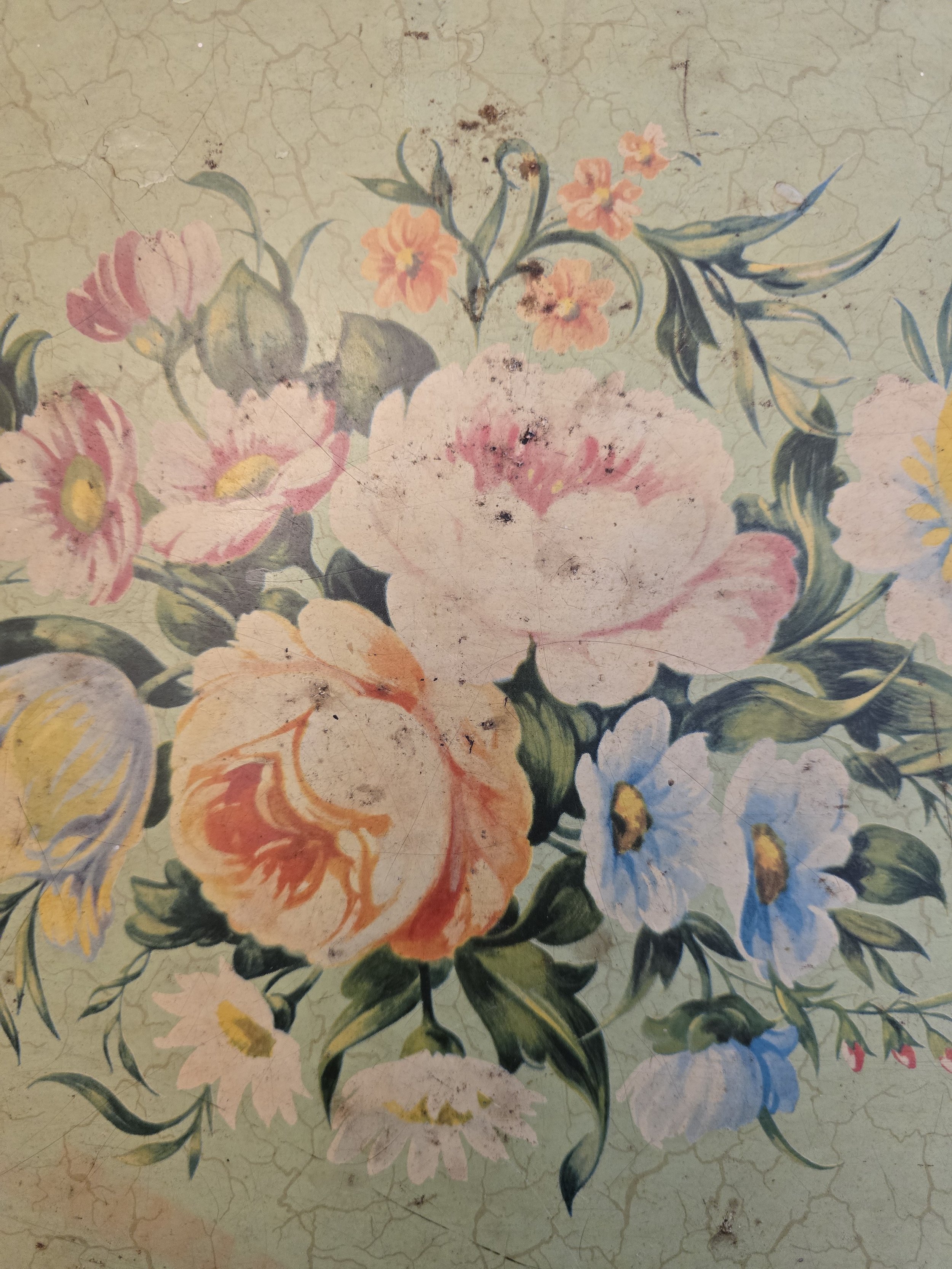 Close-up of faded painted flowers on vintage Worcester Ware folding tray with crackled finish and patina. (Copy)