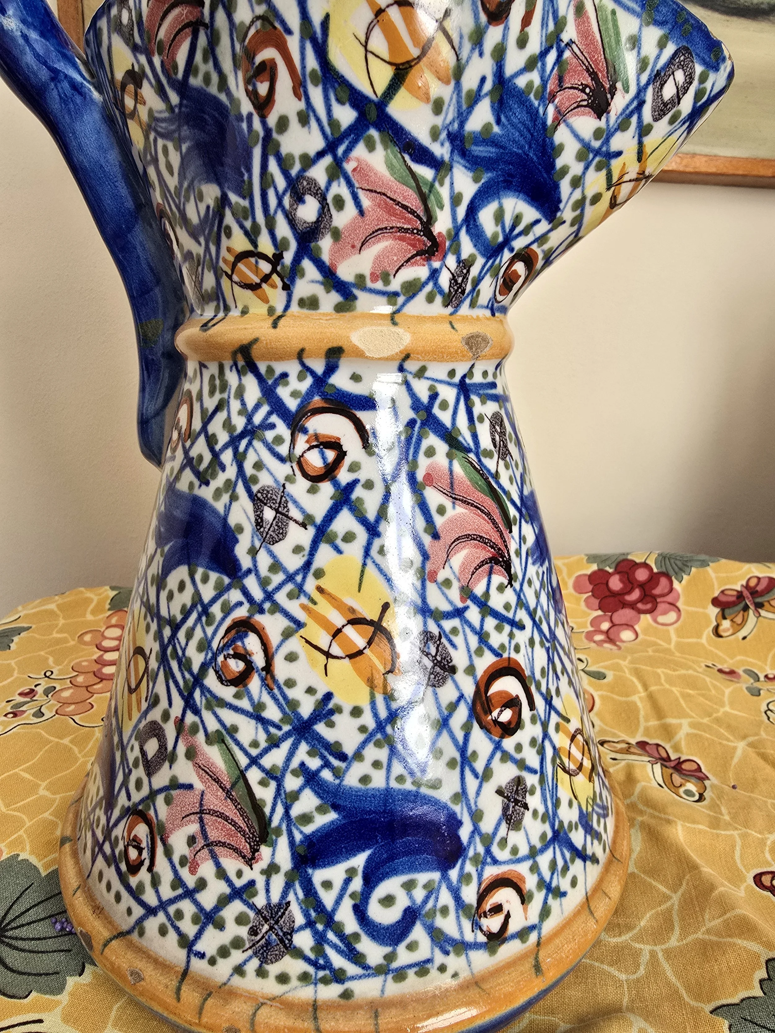 Close-up of colourful hand painted ceramic jug pattern