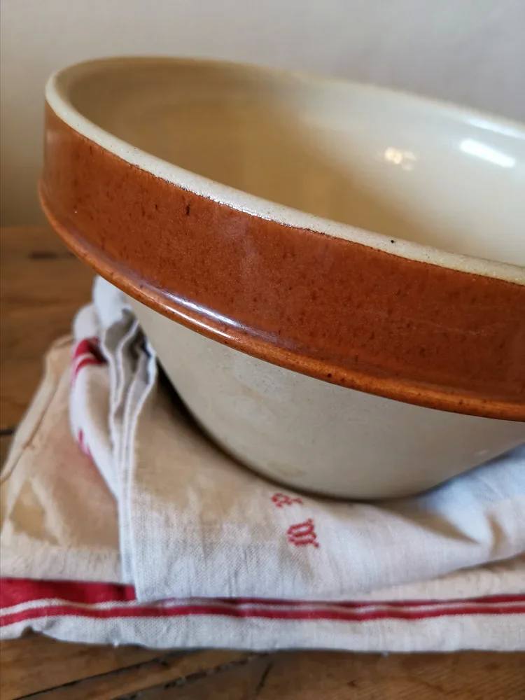 Large vintage Digoin stoneware bowl with brown glazed rim and biscuit interior