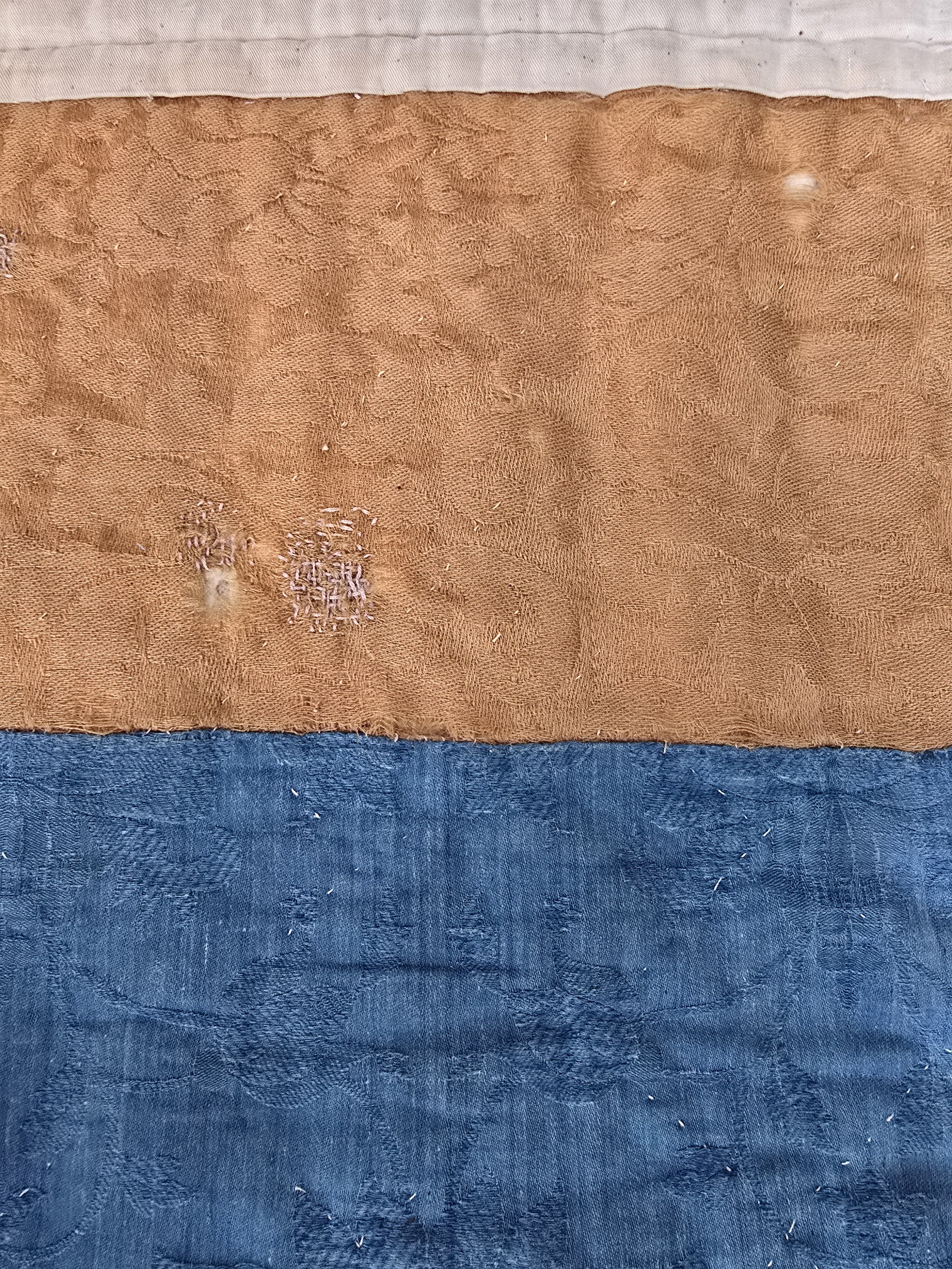 Jacquard backing in gold and indigo with lilac mending
