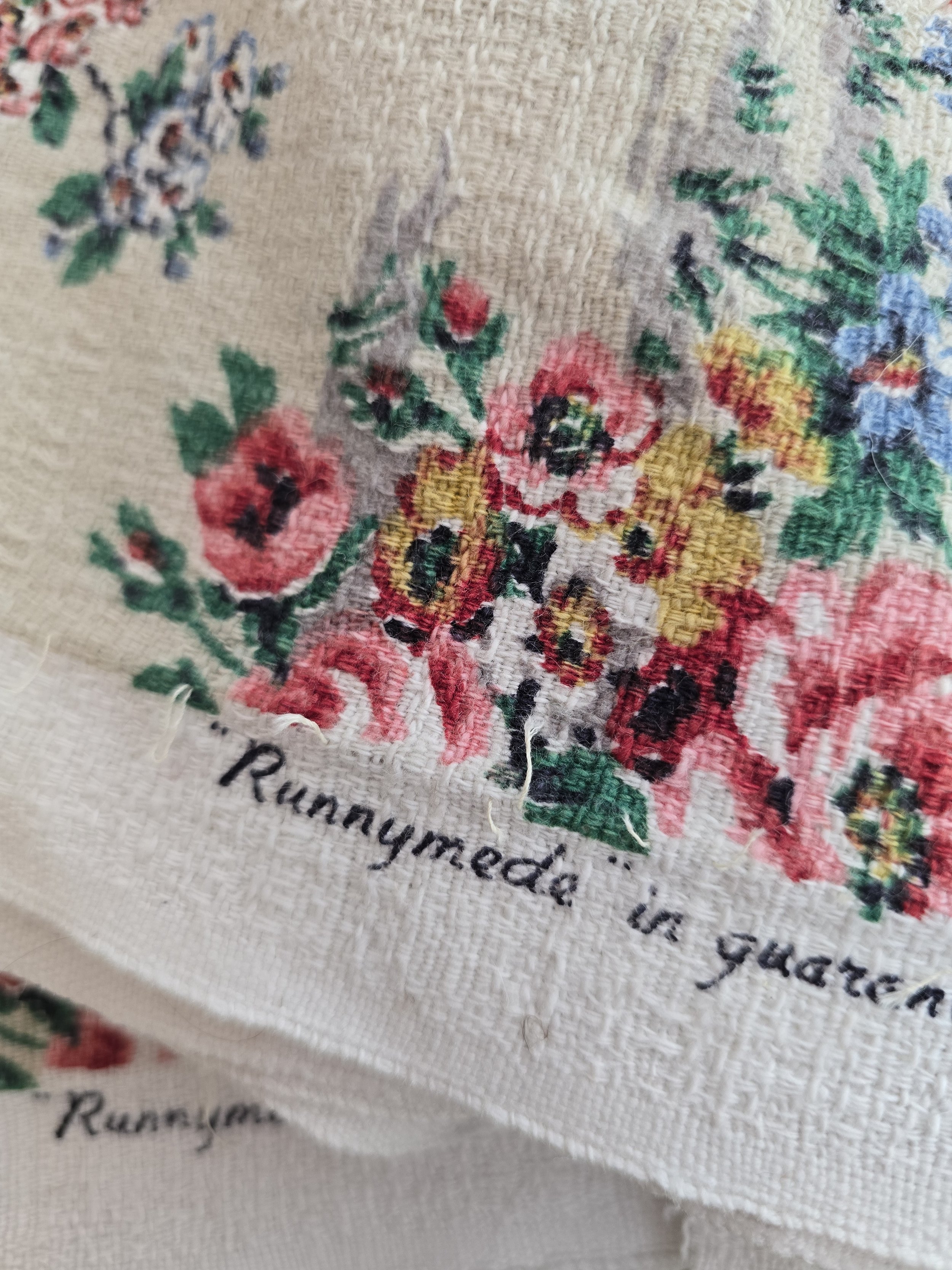 Close-up of faded floral cotton textile with pink and blue flowers