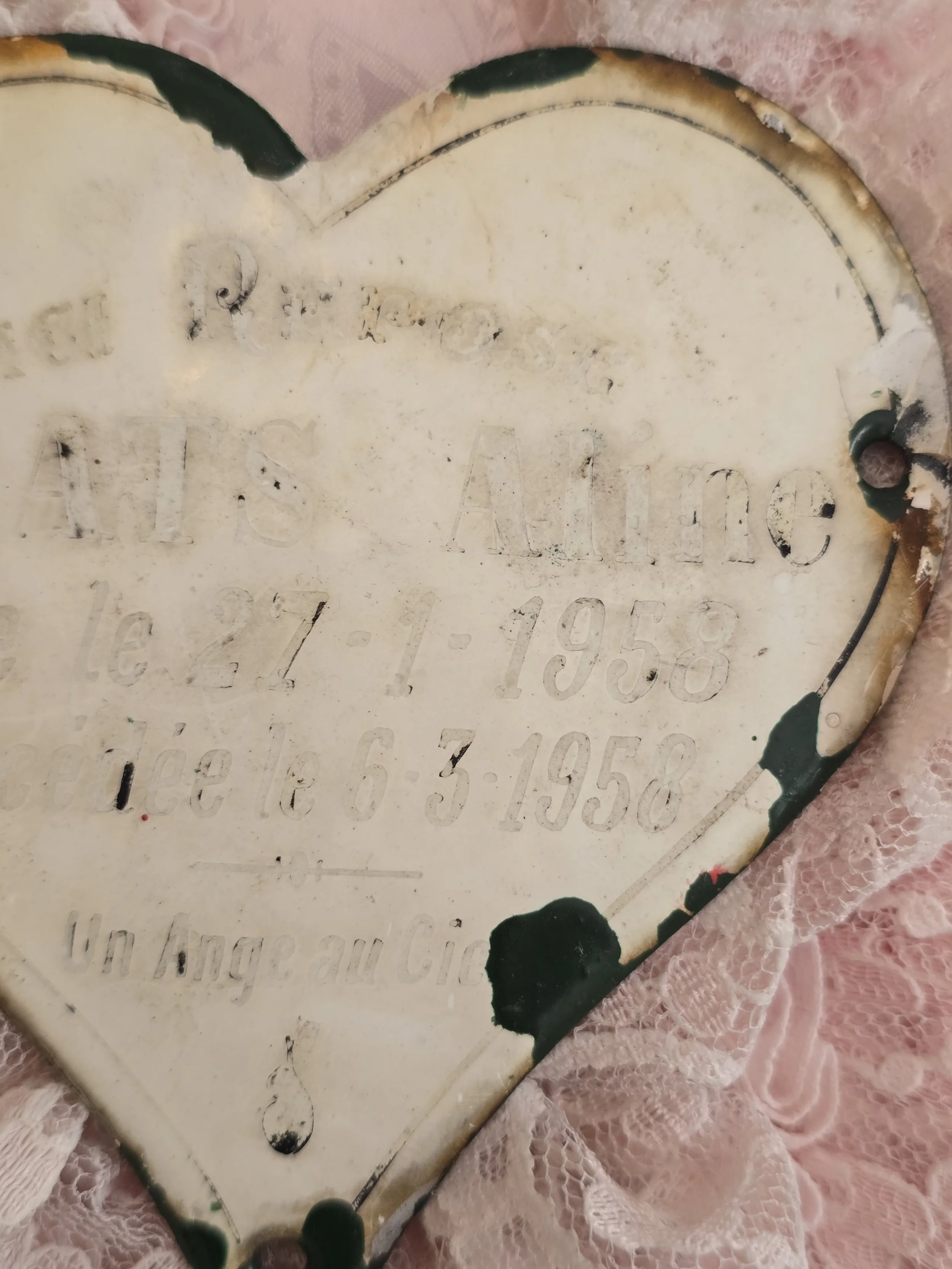 Weathered French enamel memorial heart for a young child