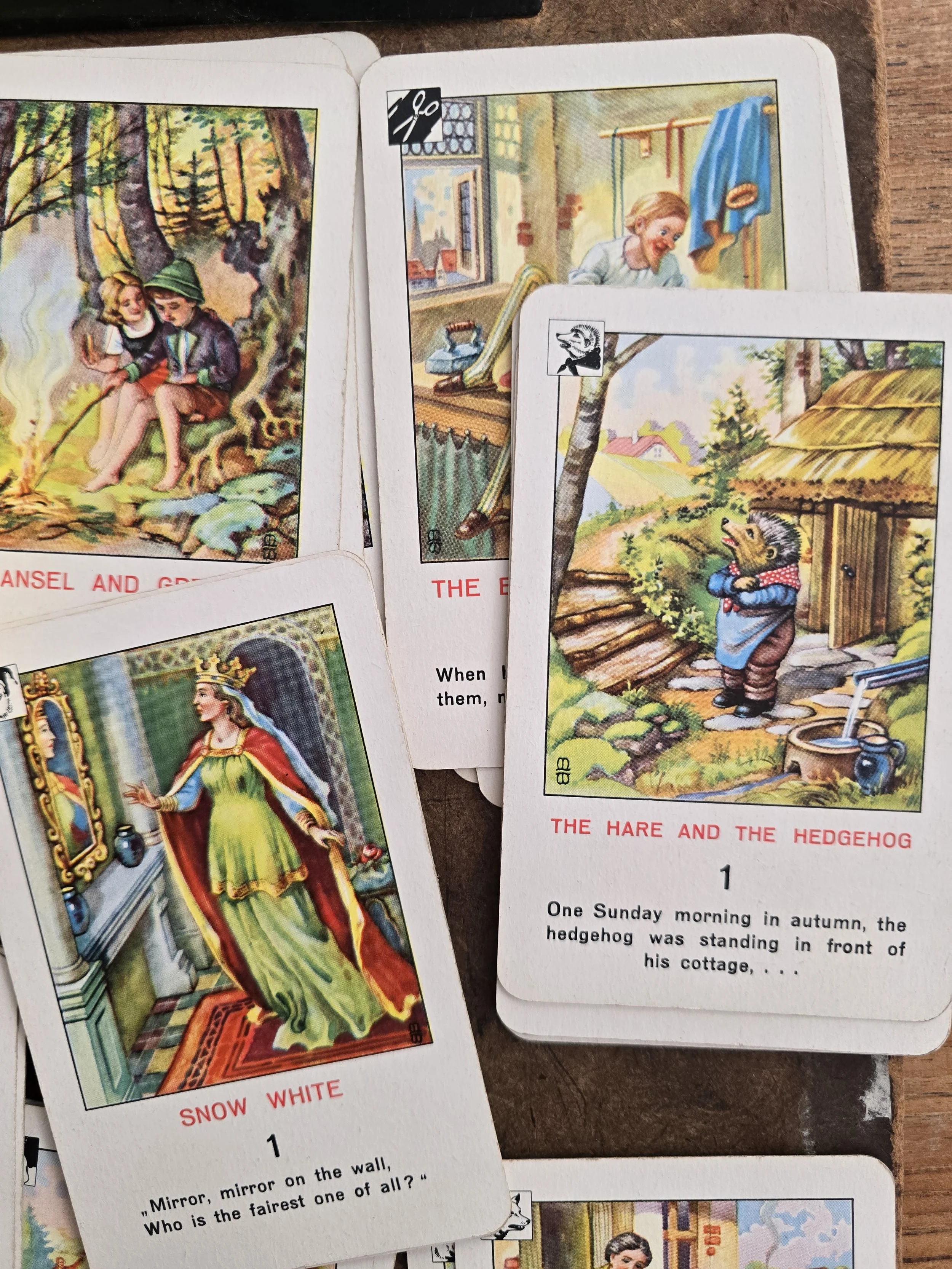 Complete collection of vintage Piatnik Grimm’s Fairy Tales playing cards arranged together.