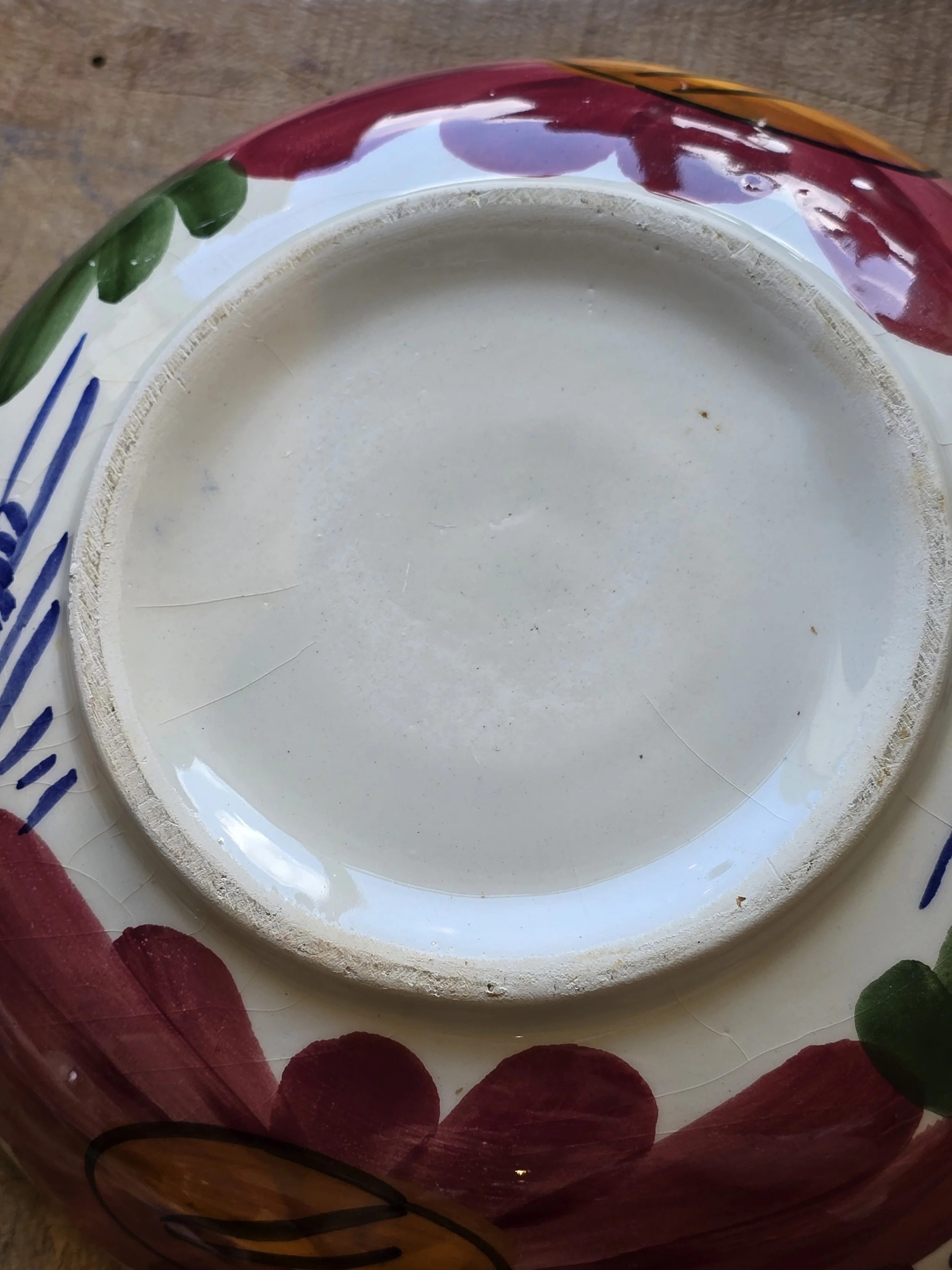 Unmarked base of vintage hand-painted ceramic bowl