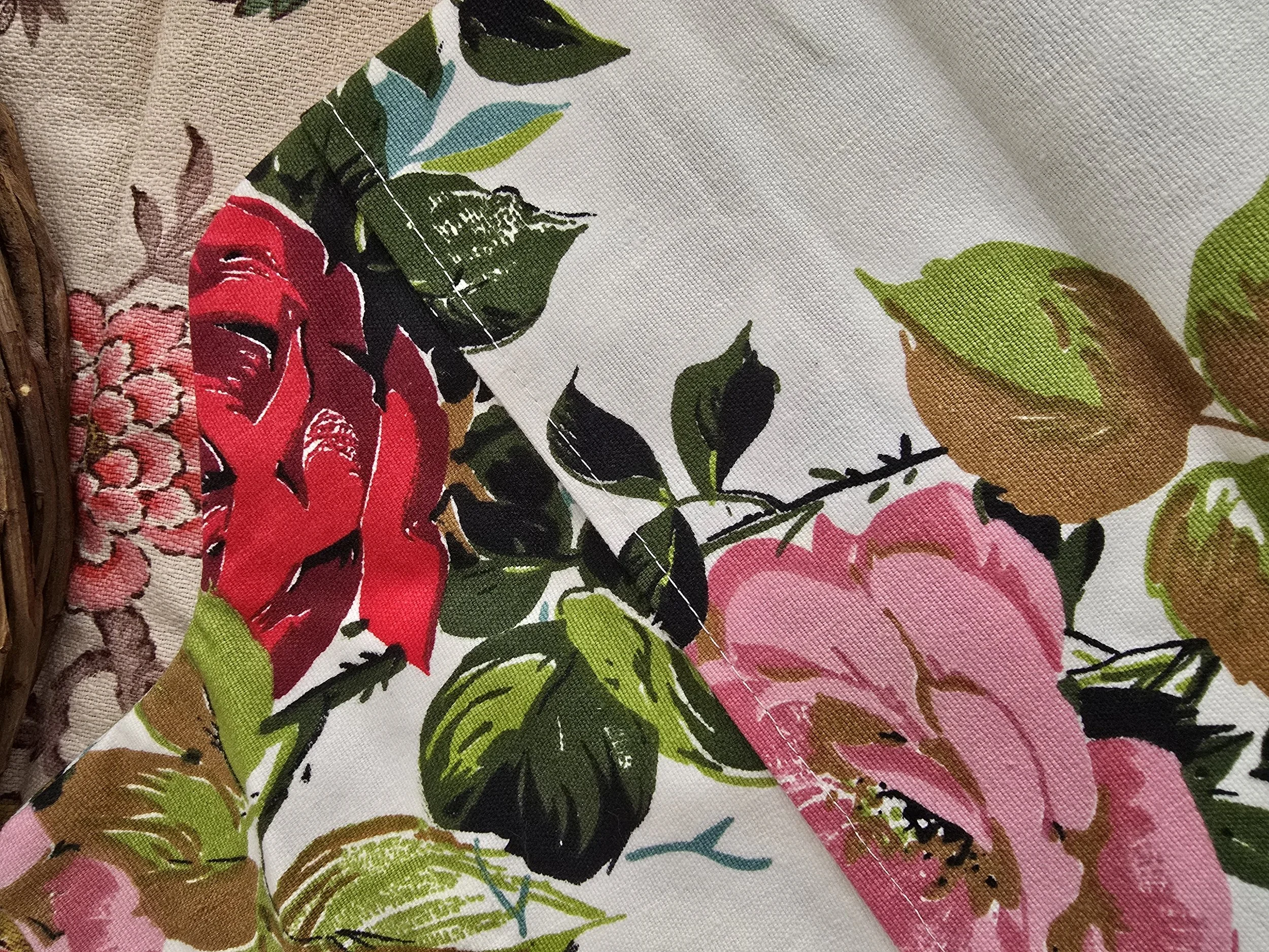Standard UK size vintage hot water bottle cover with large red and pink roses, flatlay view.
