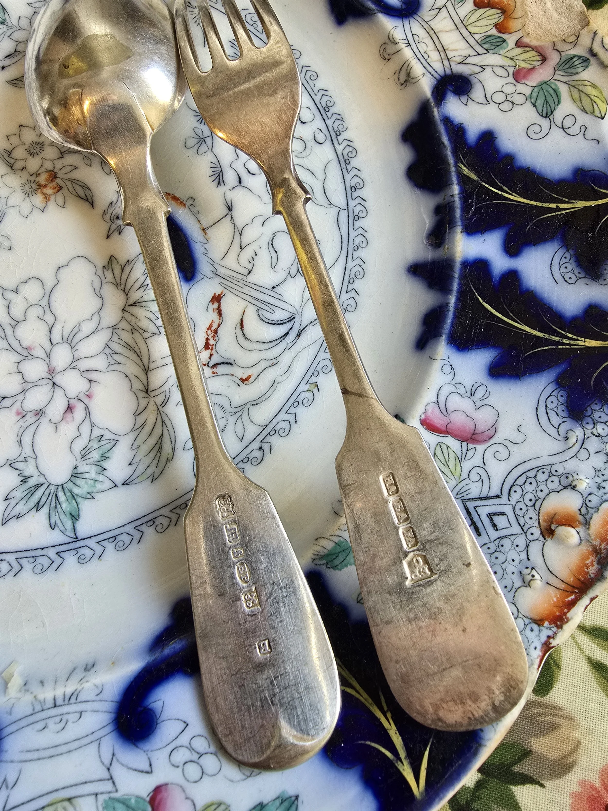 Close up of hallmarks on Victorian sterling silver fork and spoon, London 1837, William Chawner II
