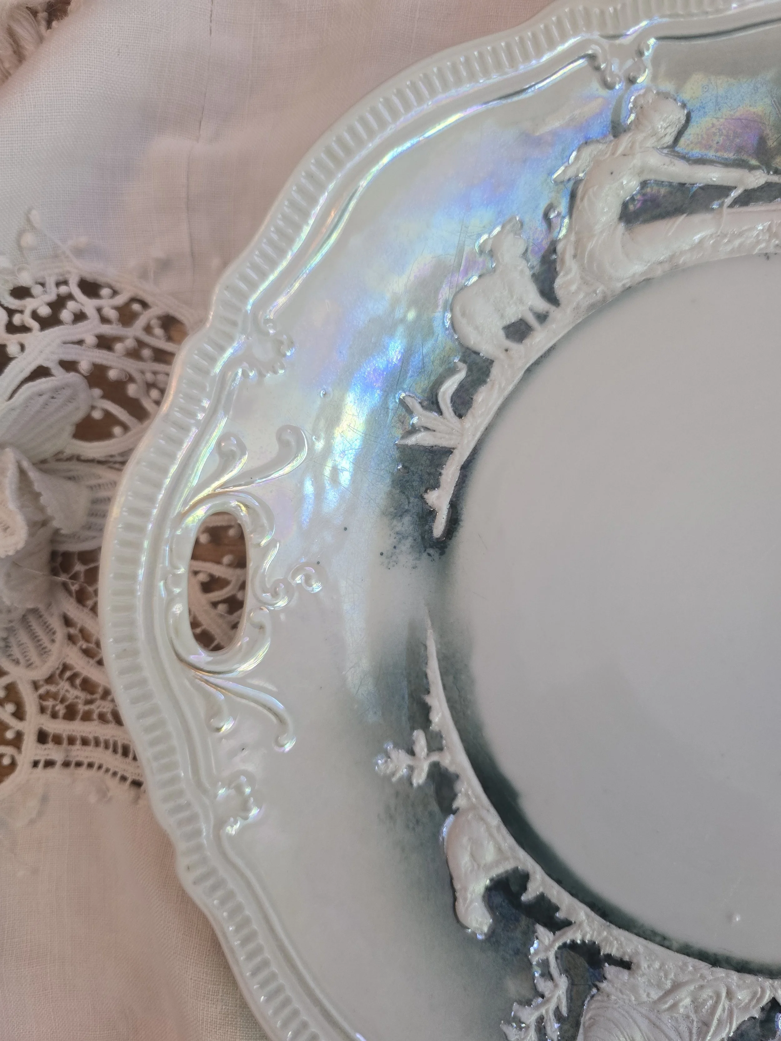Antique style German ceramic plate with pearlescent lustre and relief decoration
