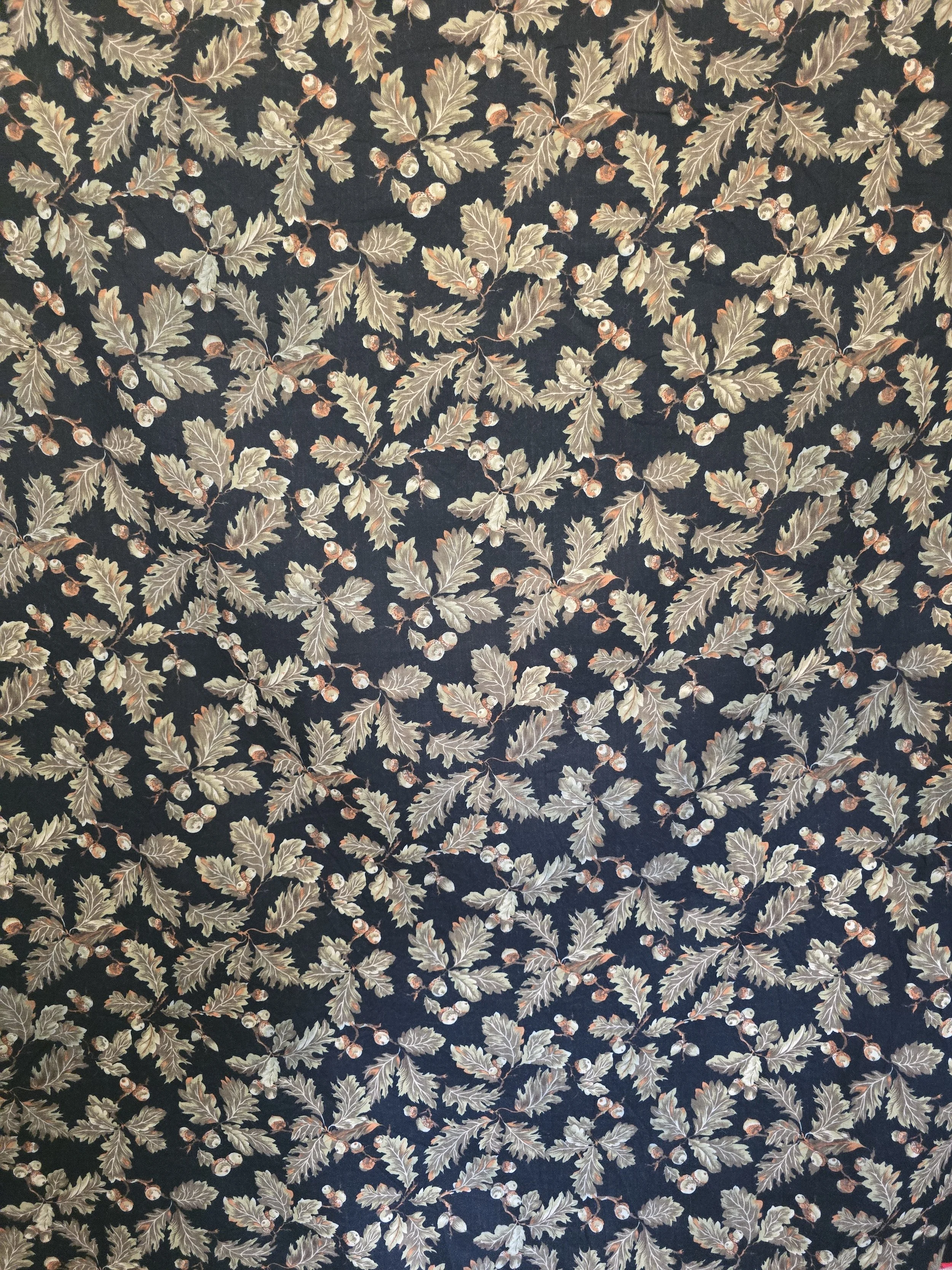 Close-up of vintage oak leaf and acorn fabric in earthy tones