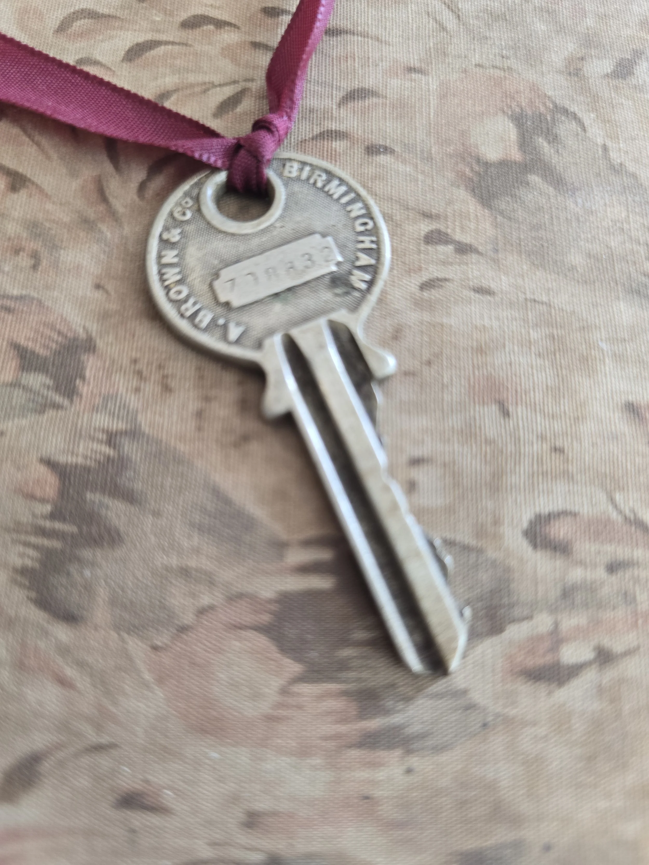Reverse of vintage AB&C key showing Birmingham maker's mark and serial number.