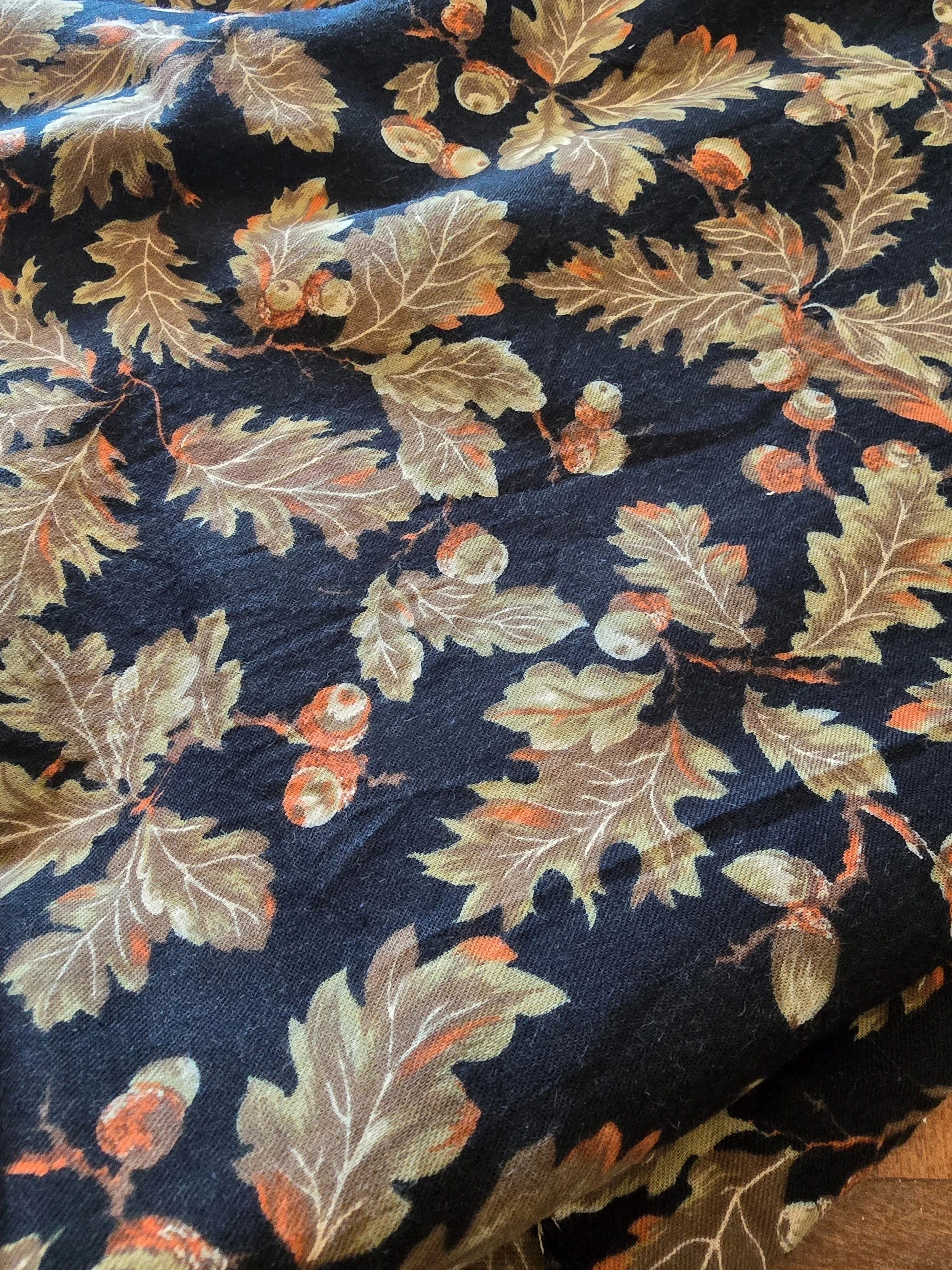 Vintage French fabric with oak leaves and acorns on a dark ground