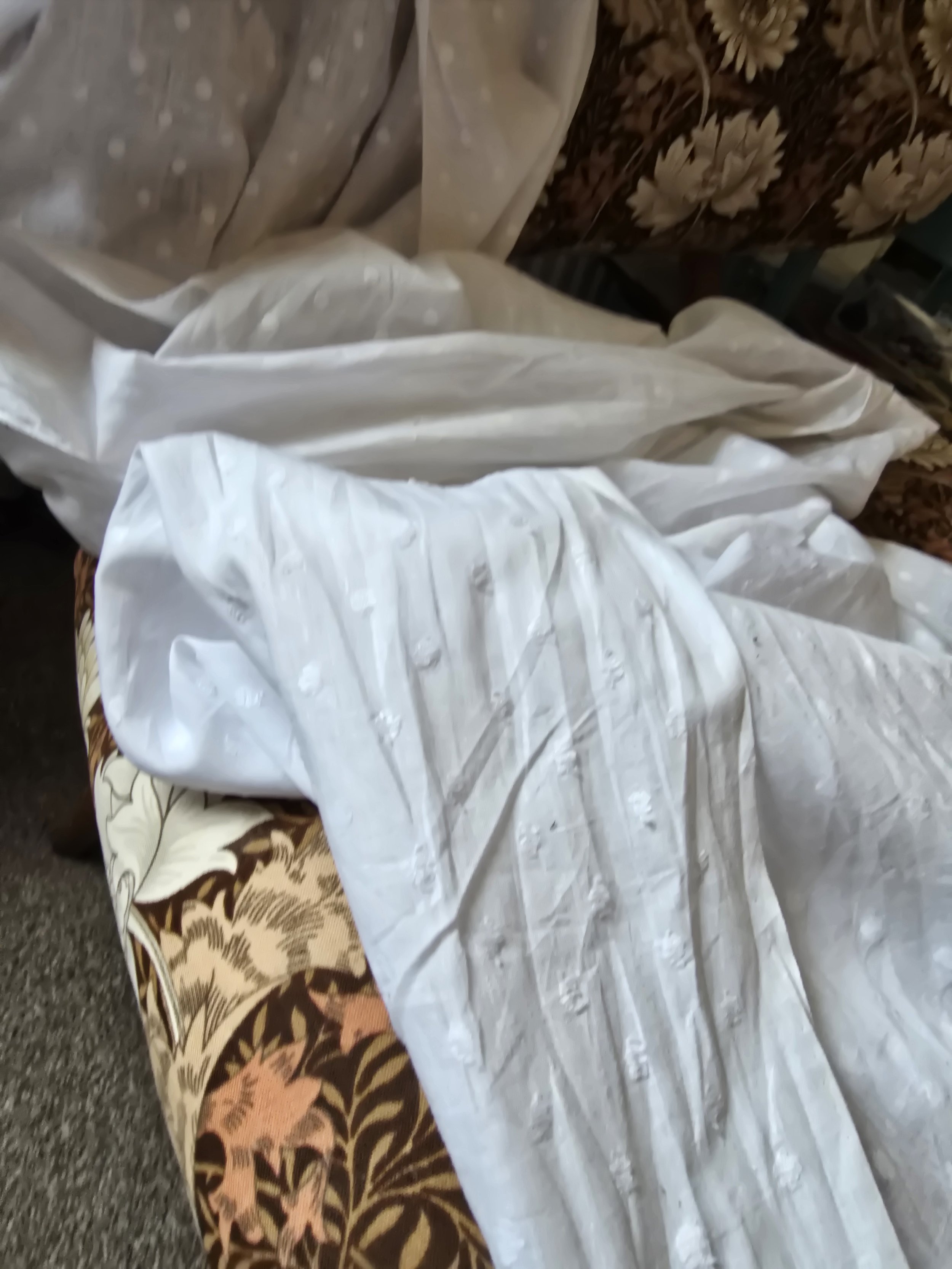 White vintage Swiss dot fabric draped on chair
