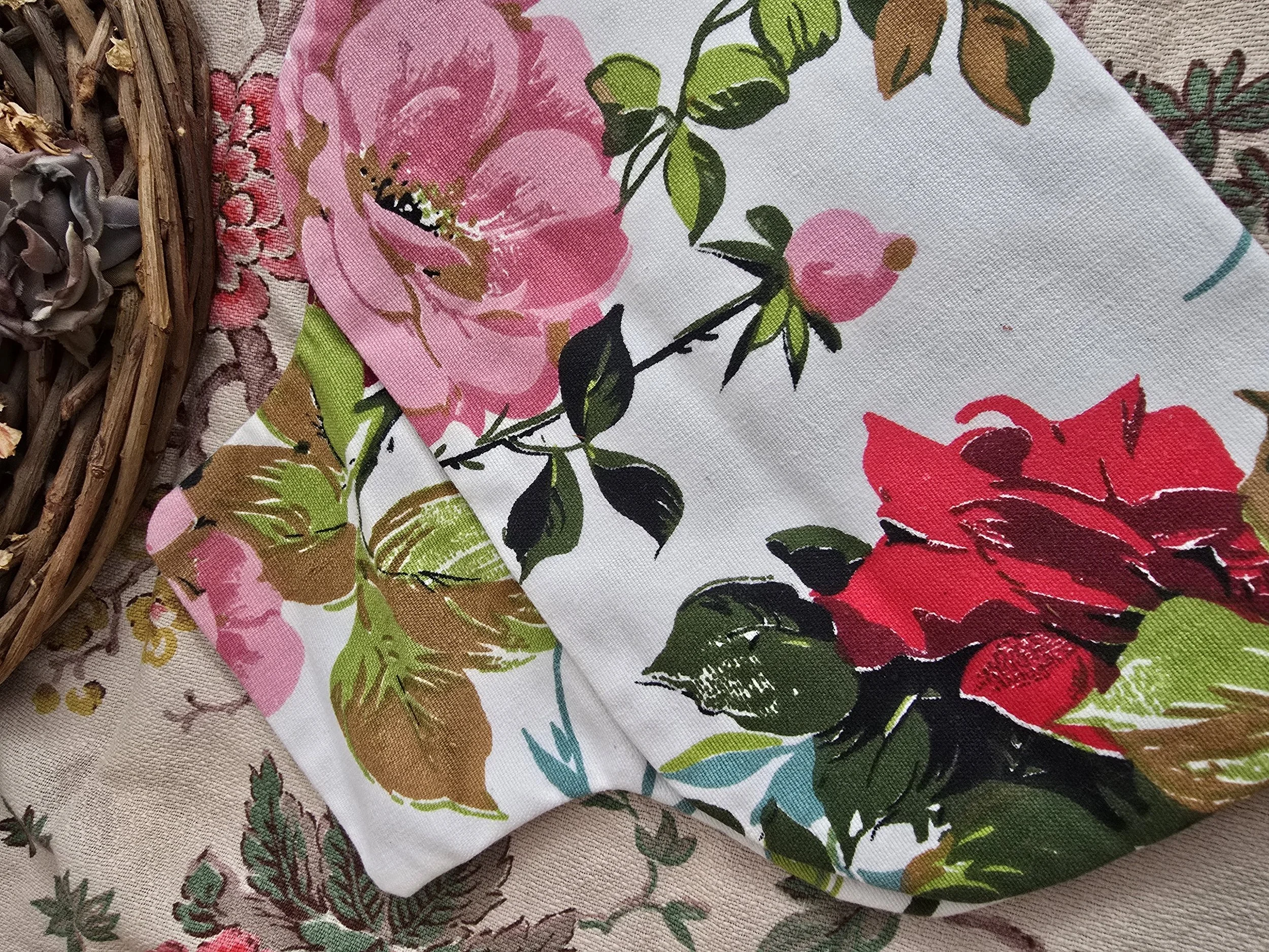 Vintage cotton hot water bottle cover with bold red and pink rose print, mid-century style.
