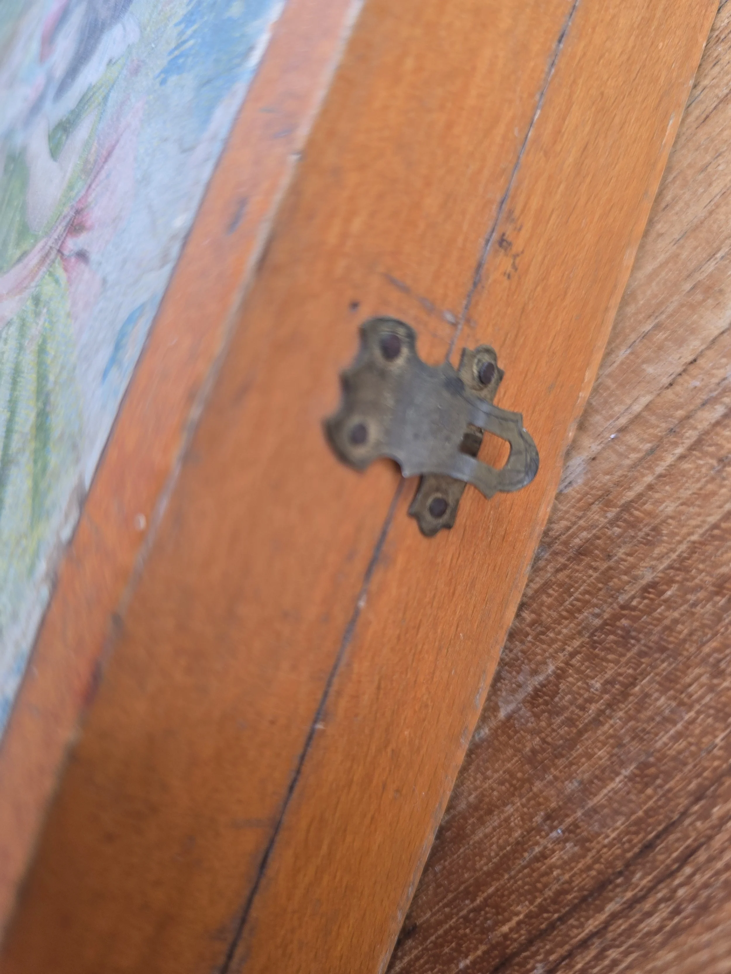 aged metal hinge detail on antique wooden puzzle box