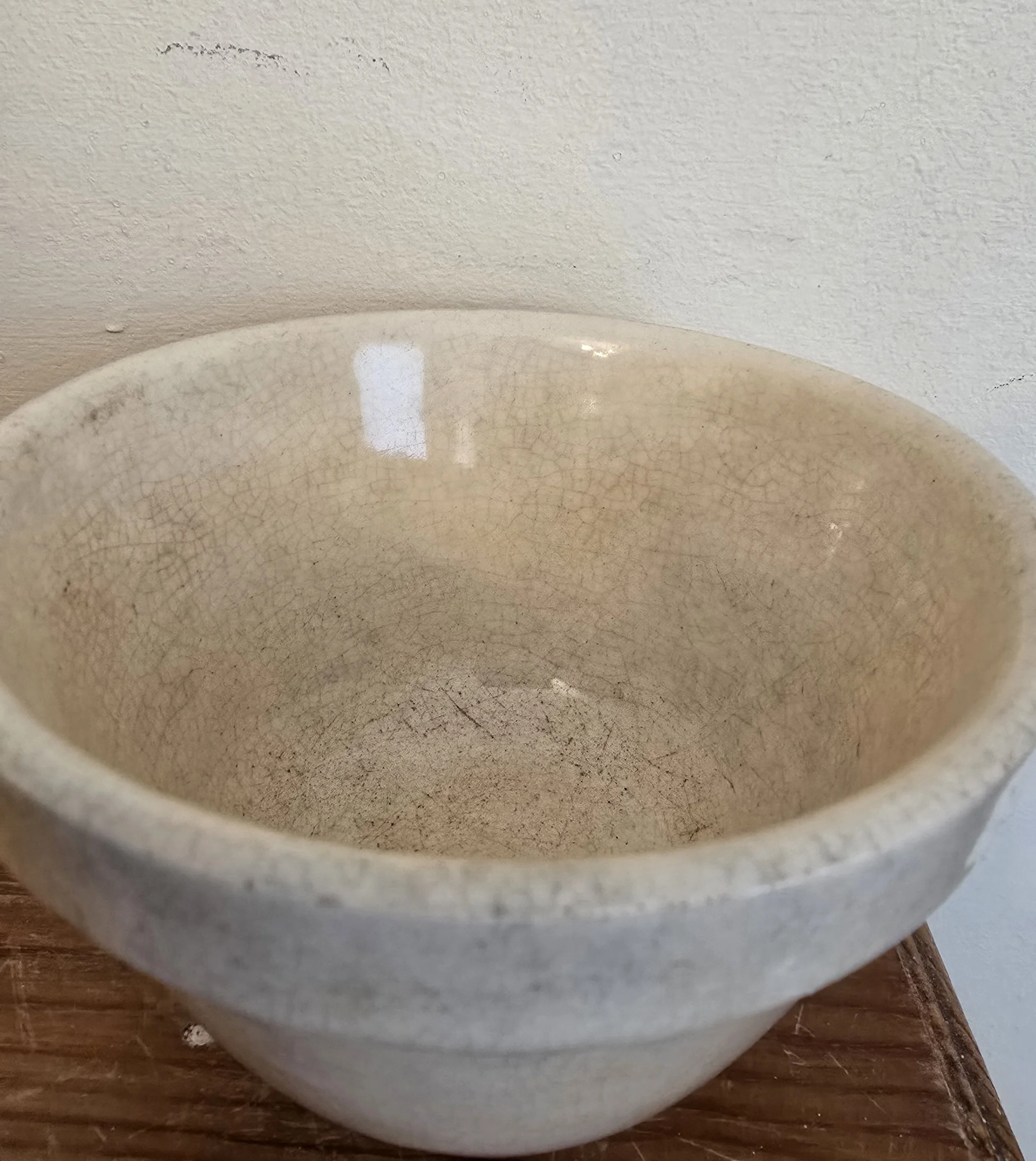 Interior of vintage pudding bowl showing aged glaze and patina