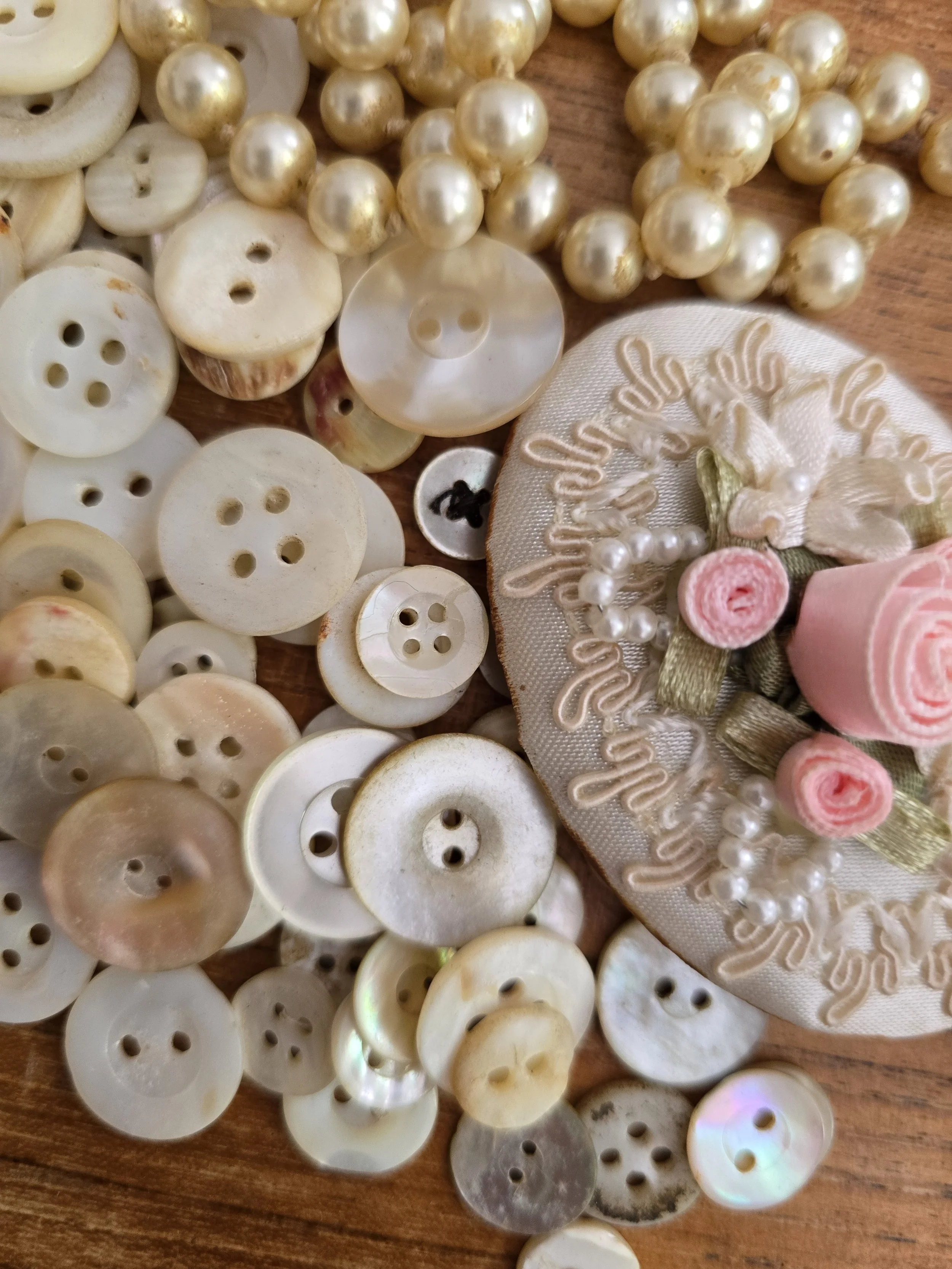 Antique mother of pearl shell buttons with beautiful natural iridescence, sold as one collection.