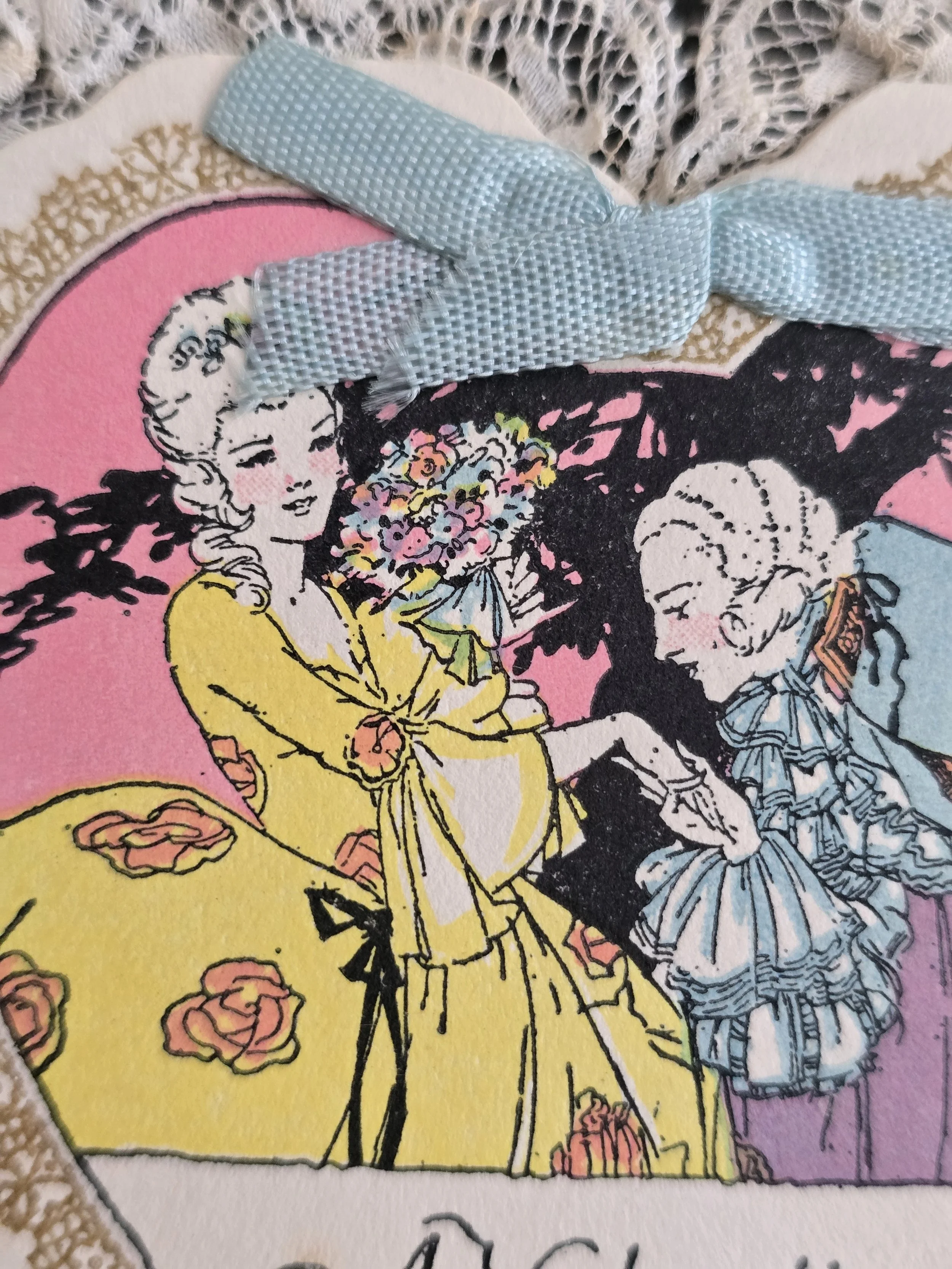 Close-up of vintage Valentine illustration showing a gentleman kissing a lady's hand.