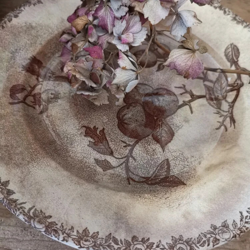 Antique crazed floral transferware plate styled with faded dried hydrangeas, photographed in soft natural light for the Pomme de Jour Gift Card.