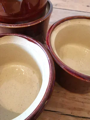 Interior view of vintage Moira Pottery ramekins with cream speckled glaze