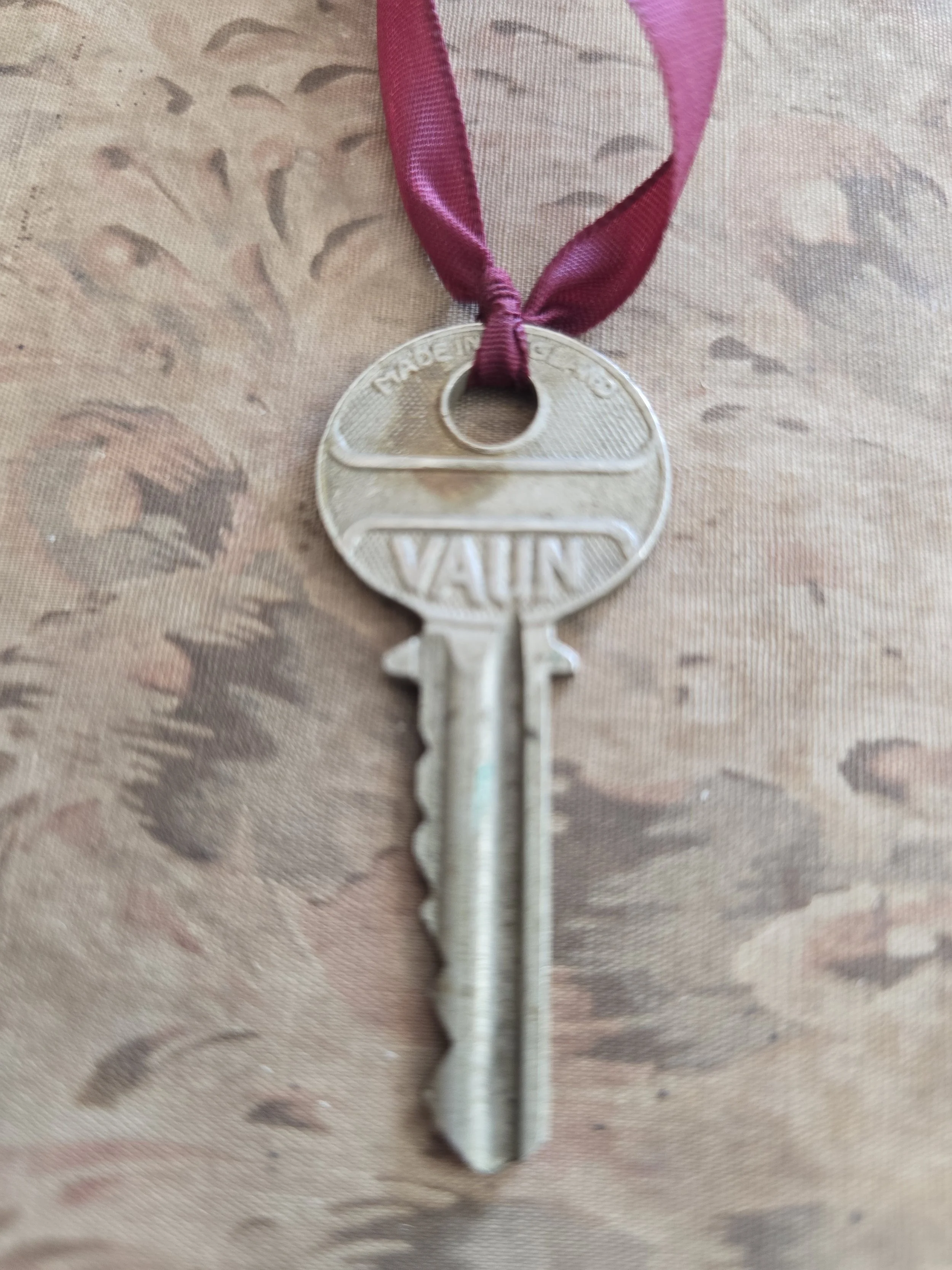 English-made vintage Vaun key with industrial design and original worn finish.