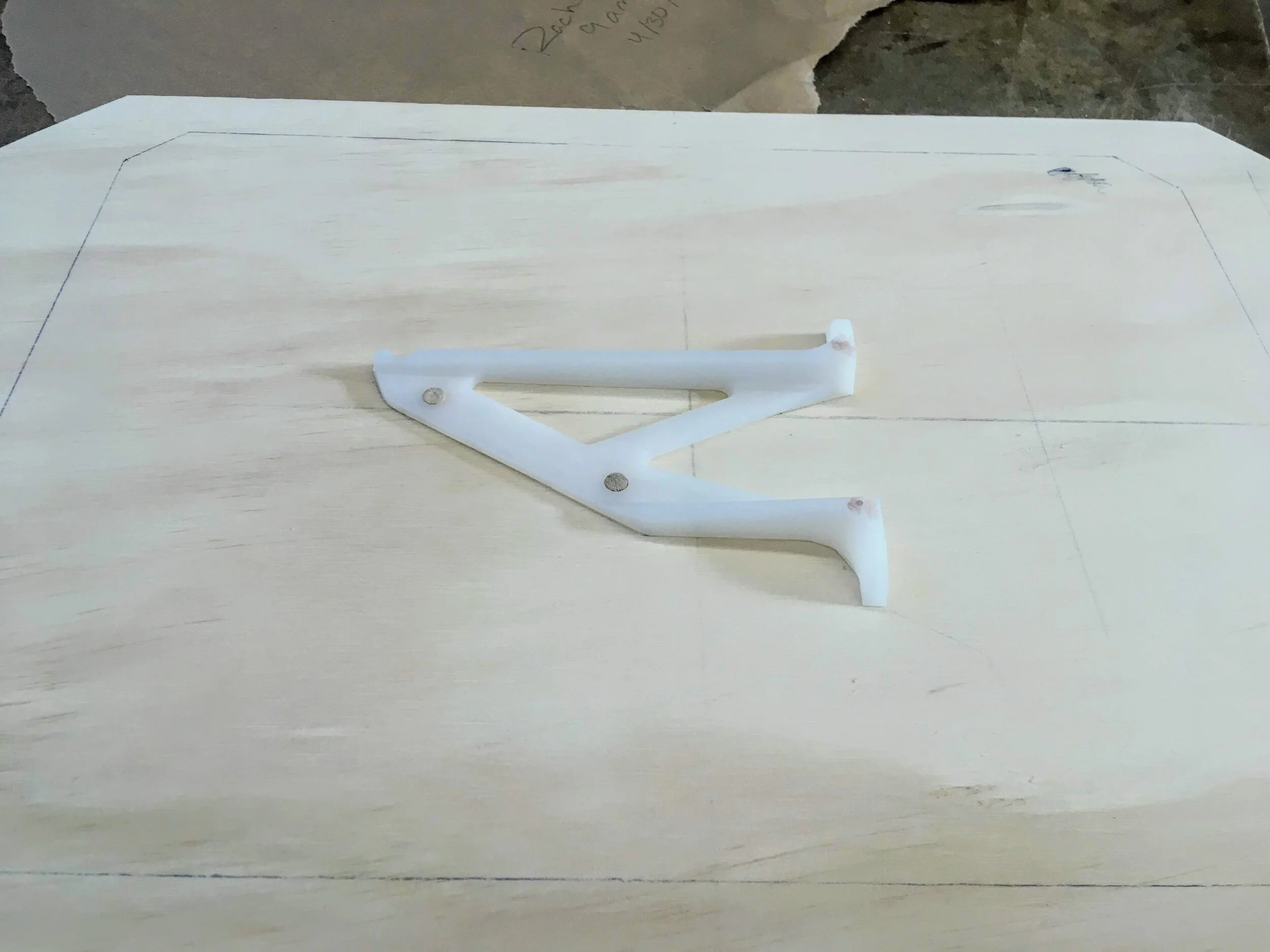 The two-sided pattern affixed to the pattern-board with dowel pins for alignment (before applying shellac).