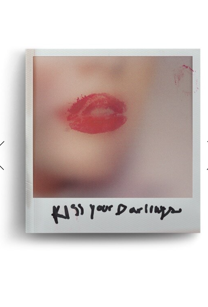 Colver of Kiss Your Darlings, meant to look like a blurry polaroid of the bottom of a women's face with a lipstick mark over the lips