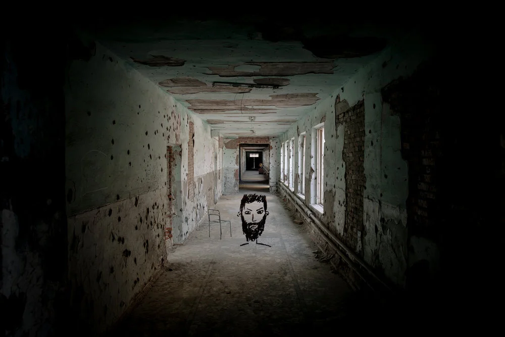 The hallway of School No.1. An uncountable number of bullet holes and shrapnel-marks scar the walls of the school.