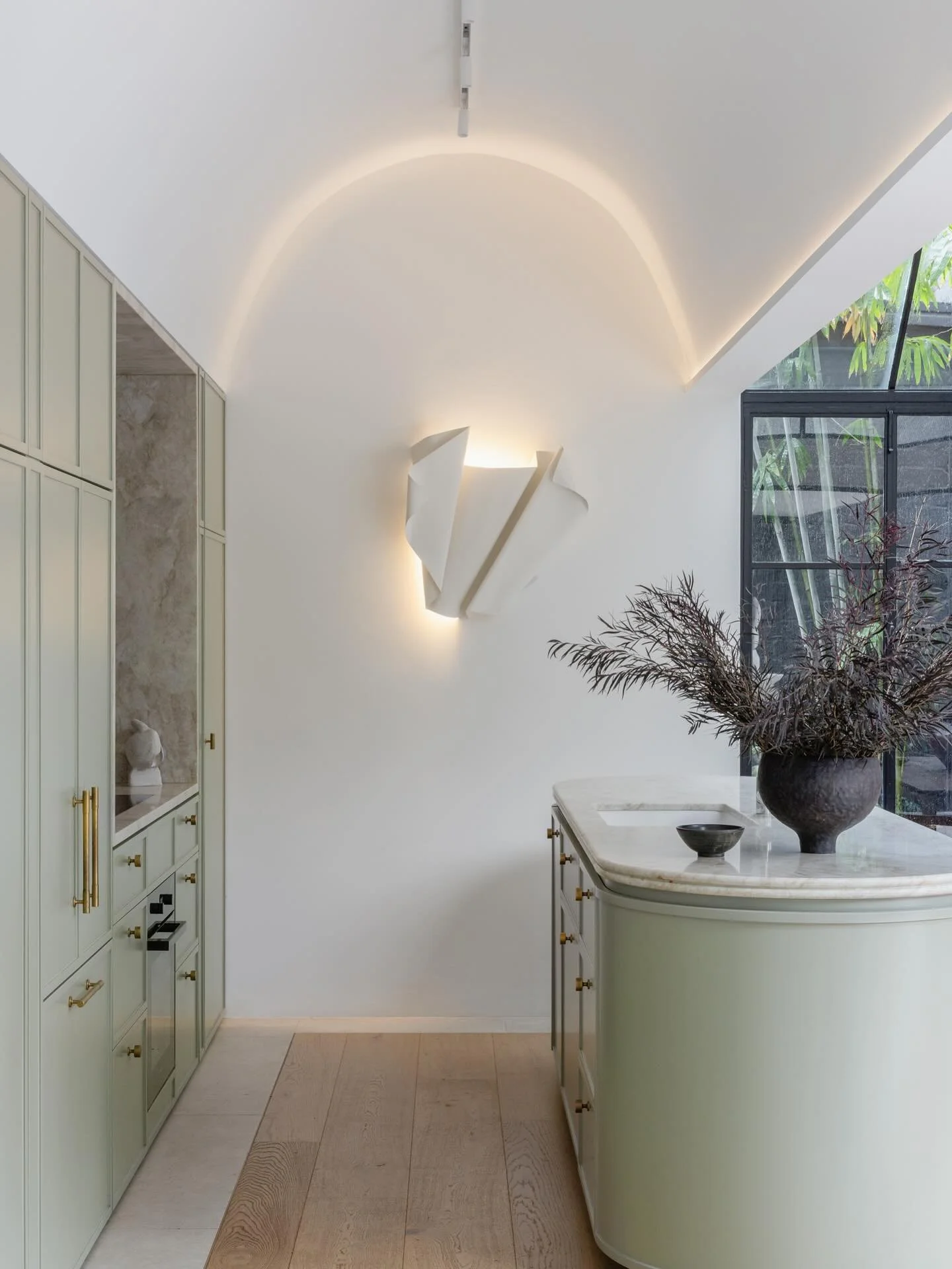 Kitchen at Arch Nouveau. A natural palette of sage, timber and light quartzite stone created a calming space for our clients. We love how the old vaulted ceiling frames a stunning steel light sculpture by @the_visuals_ 

Photography by&nbsp;@_katlu 
