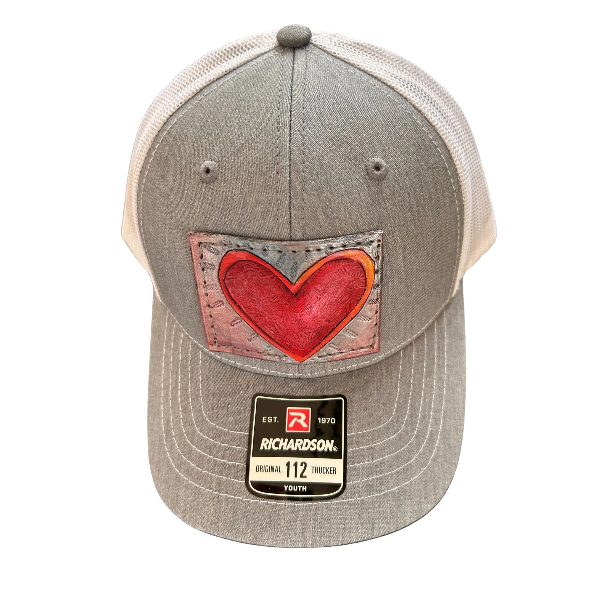 hat with handcarved and hand-painted leather of a colourful heart