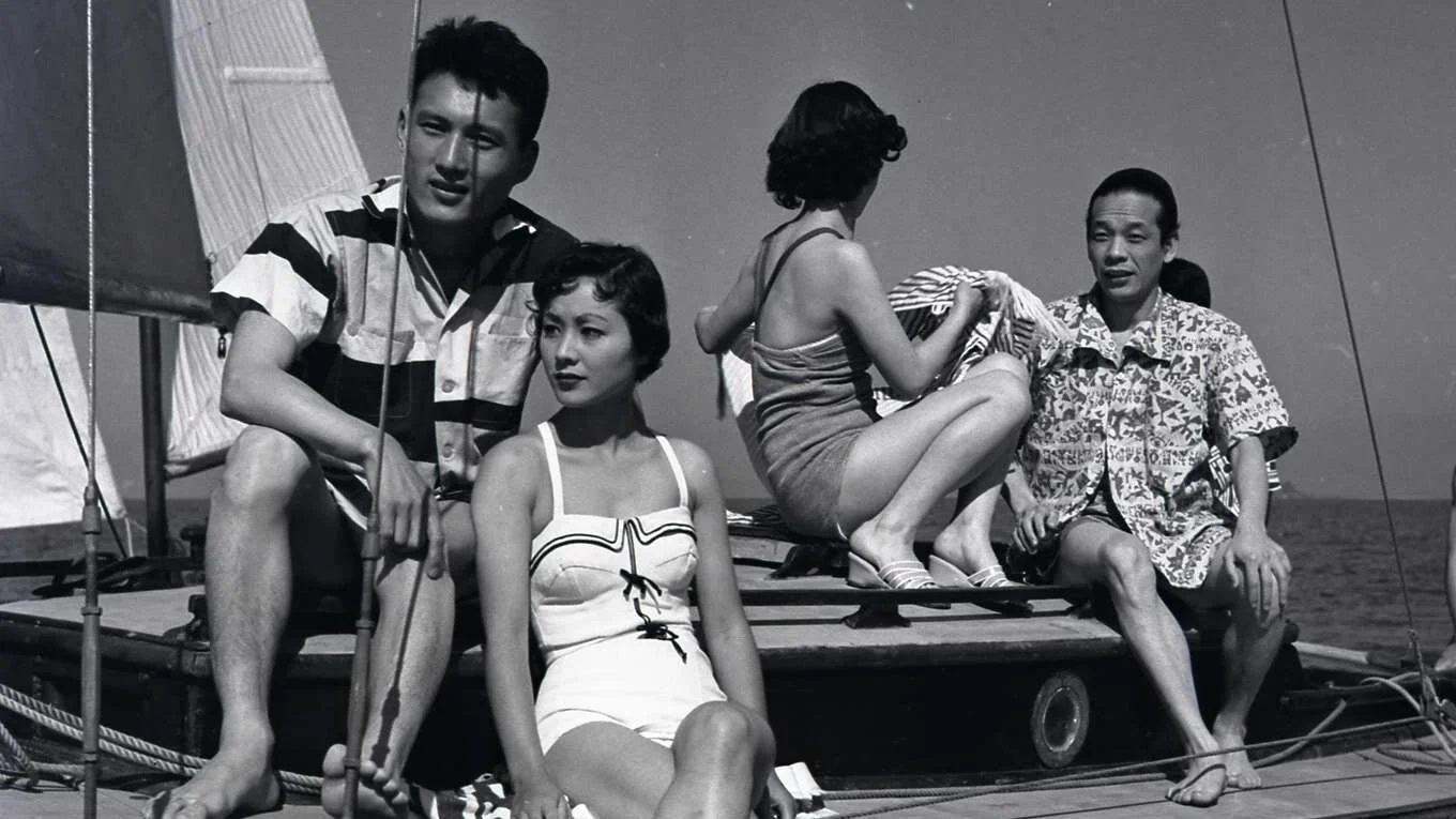 rich youngsters lounge on a boat in Season of the Sun | source: unext