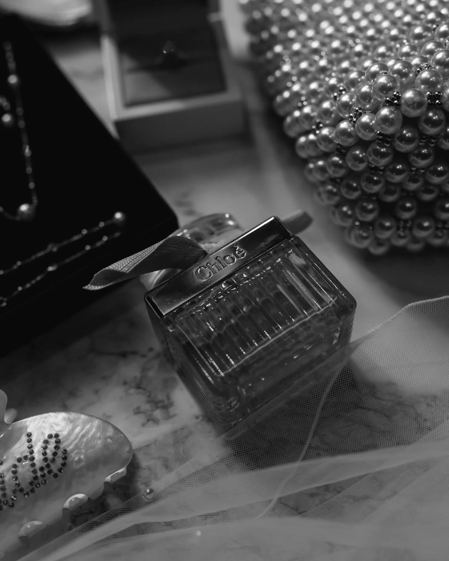 One of our favourite things to do is a details shot. Gathering all the little pieces you have chosen and giving them a moment to shine. The things that add to completing the picture of the moment - the smell, the style, the sparkle. All chosen to be 