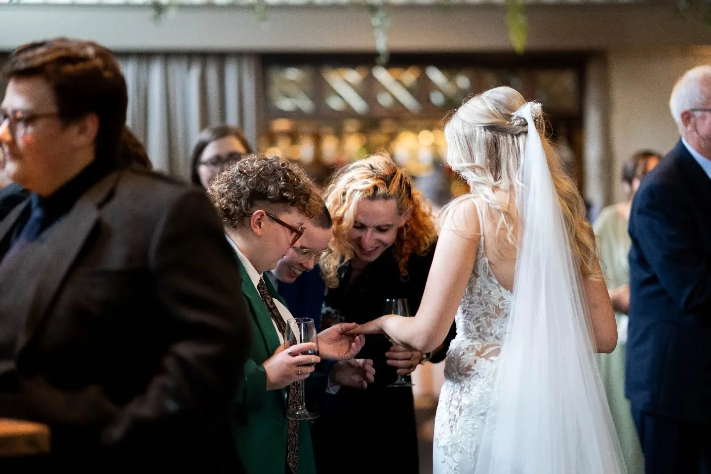 Absolutely love catching moments like this. You've been out for your couples photos, come back to your drinks reception and  are greeted by your besties gushing over your wedding band now joining your finger. The day you planned for finally here. It'