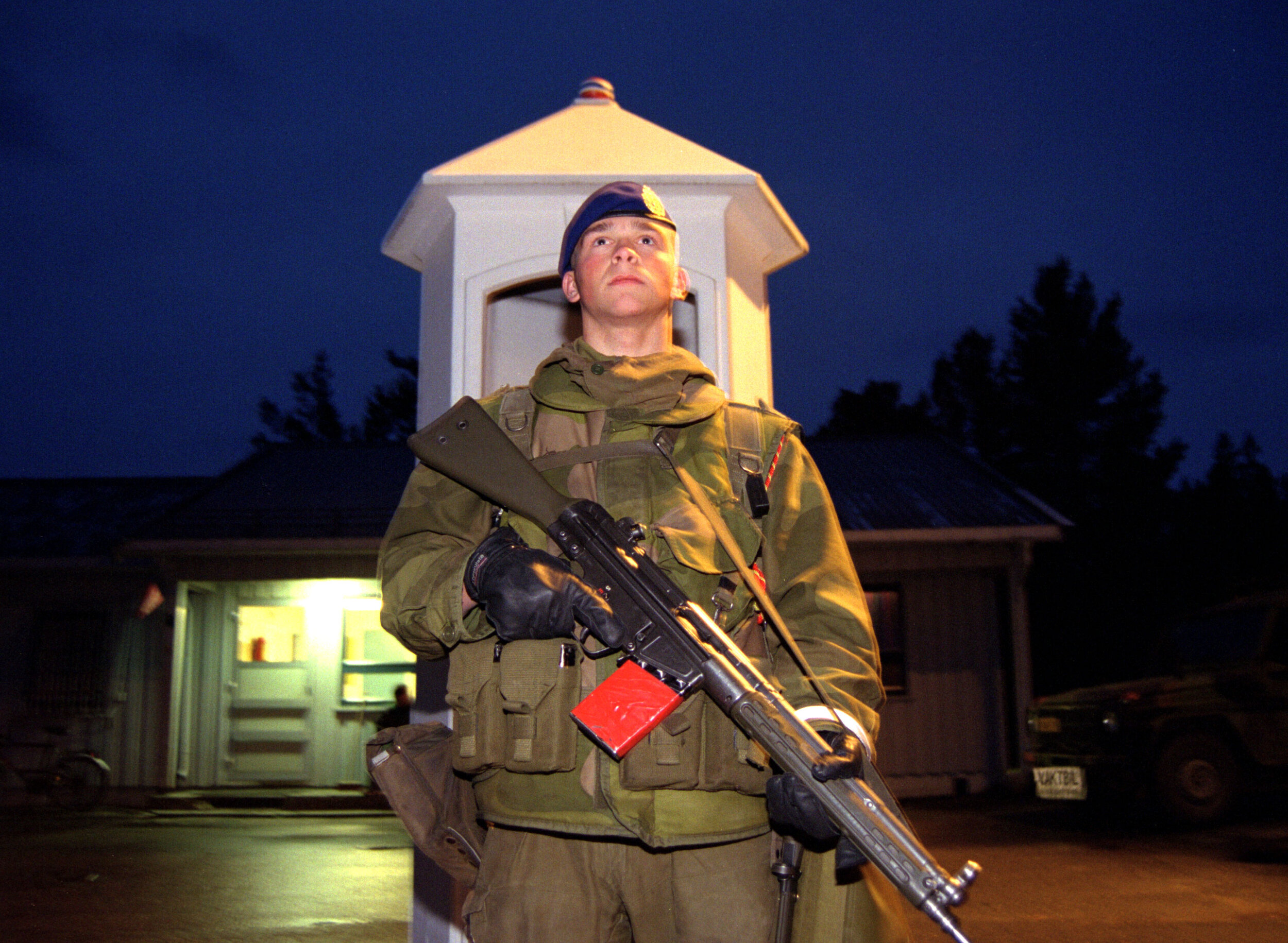  Gate guard at an army camp in northern Norway, 1998. The red taped magazine denotes that it is loaded with blanks. 