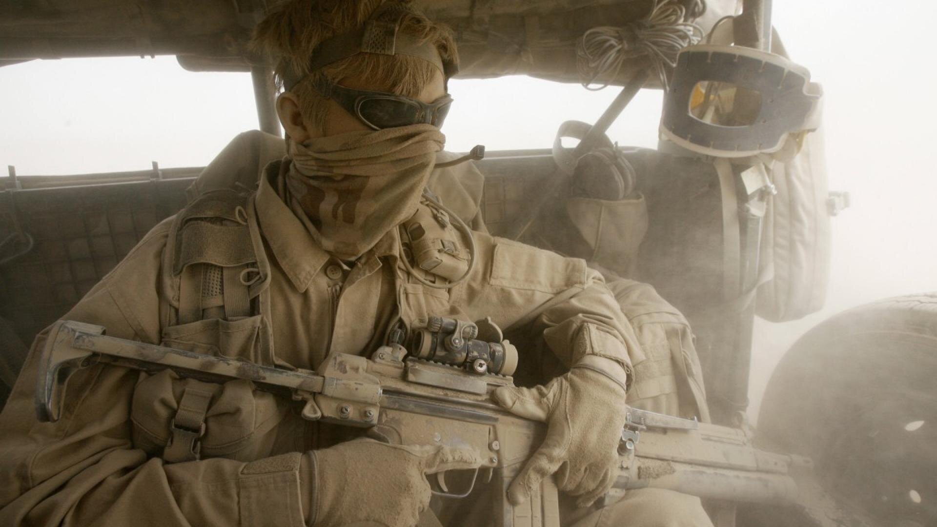  Famous picture of a Norwegian solider in Afghanistan caught in a sandstorm. He is holding his thumb over the ejection port of his AG3F2 to prevent the ingress of dust into the action.  