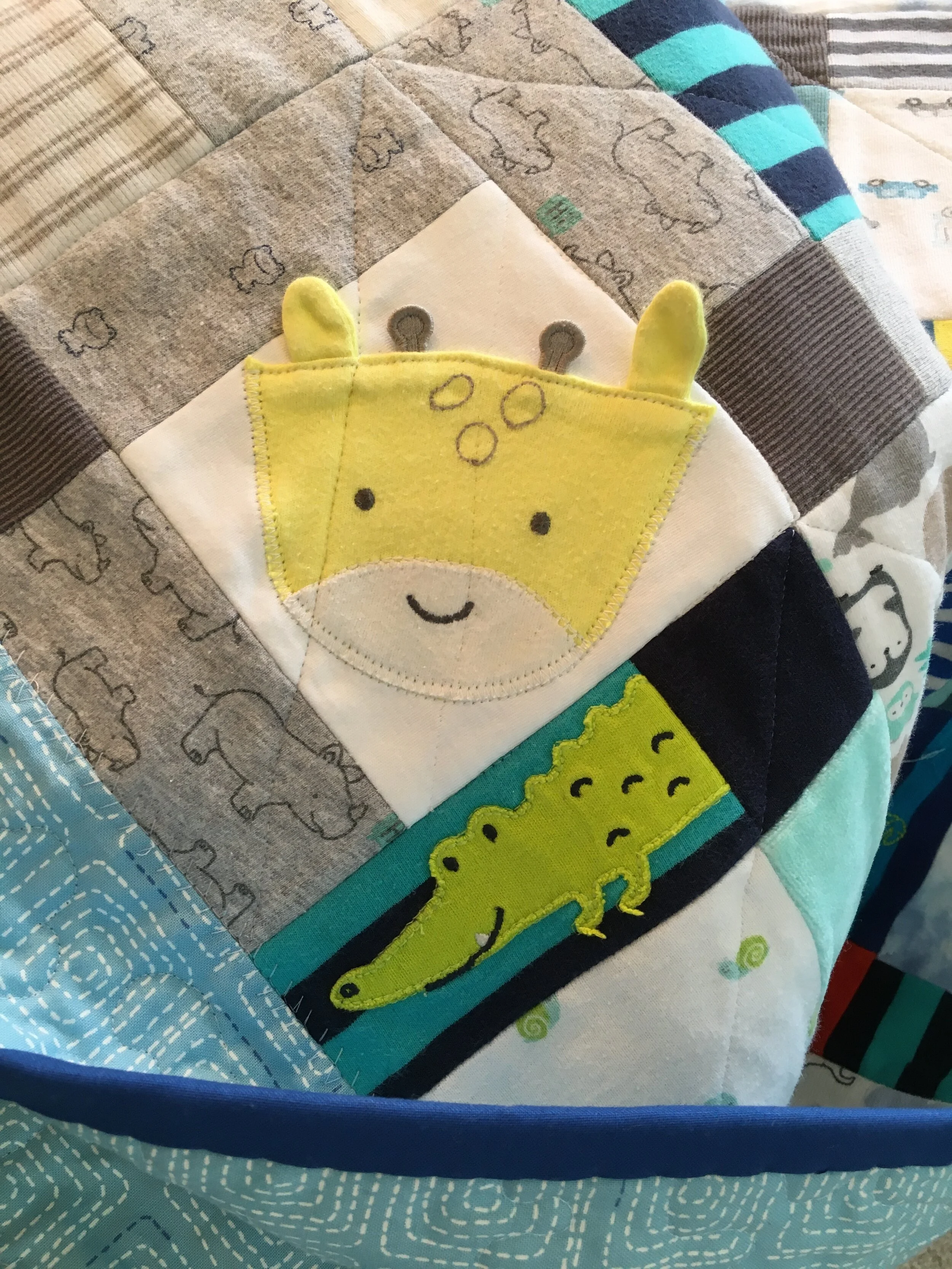 Footie animal removed from onesie sleeper as a 3-D 