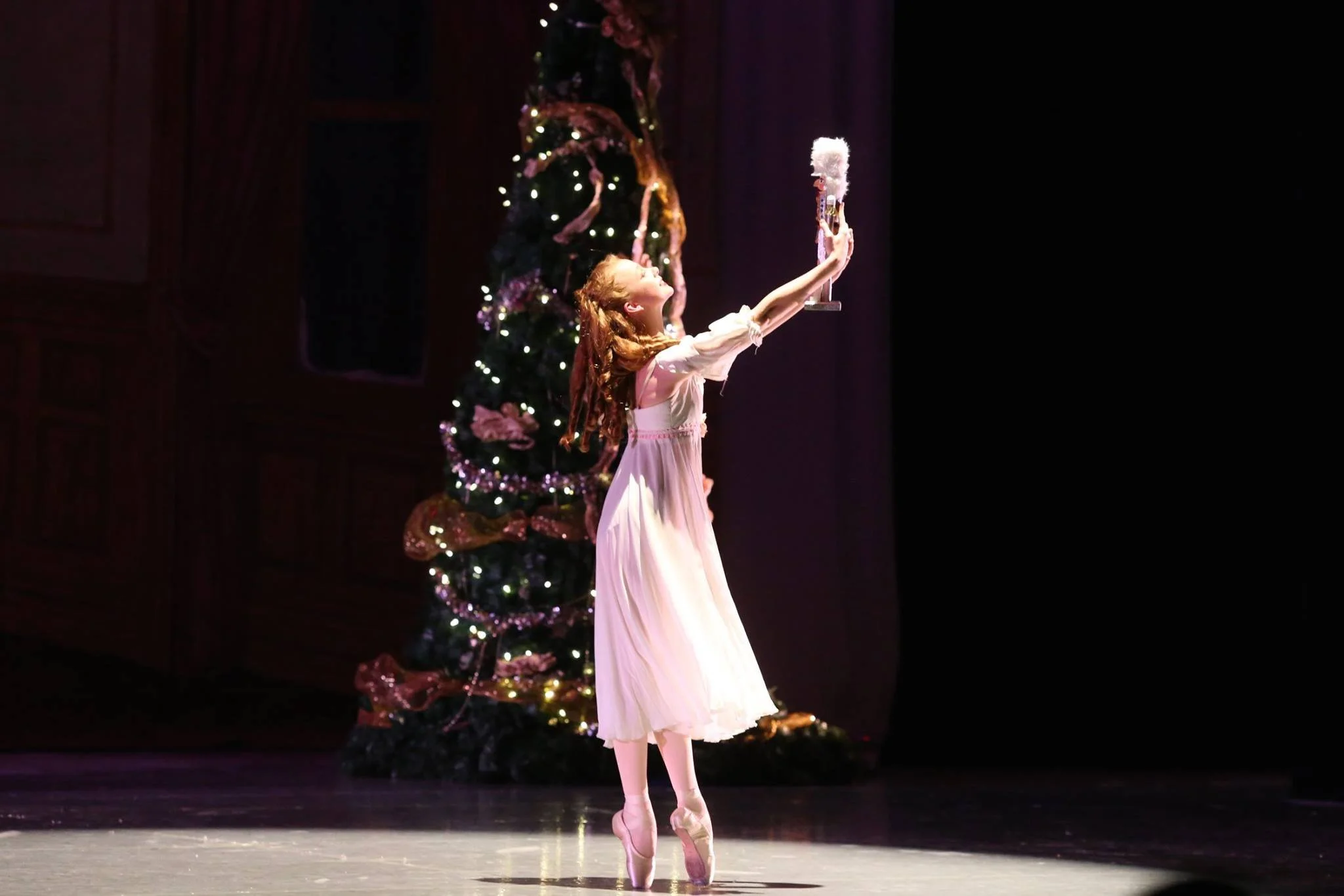 Promotional poster for the 25th season of Philadelphia Nutcracker ballet featuring dancers in costumes on stage, with colorful text and decorative elements.