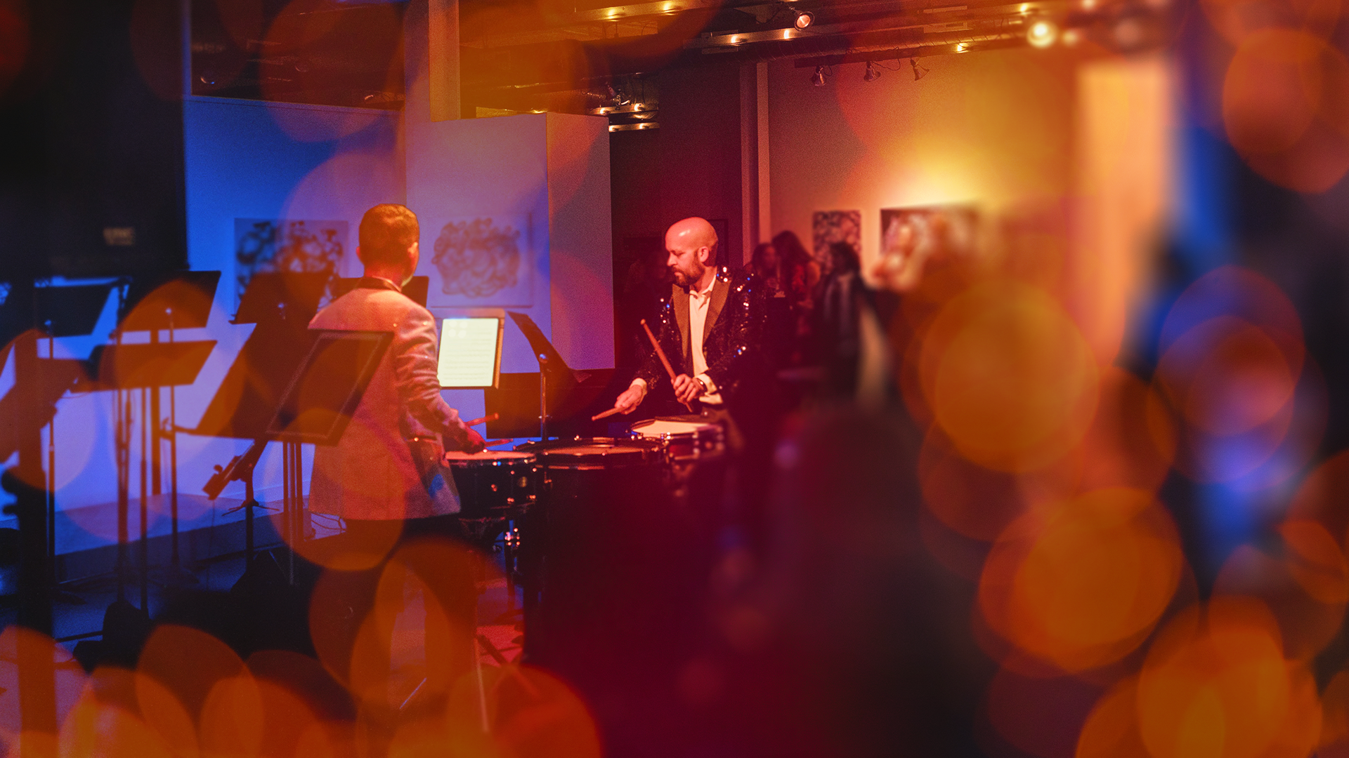 An image of two percussionists performing in front of an audience