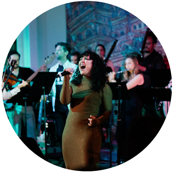 A vocalist singing with an orchestra