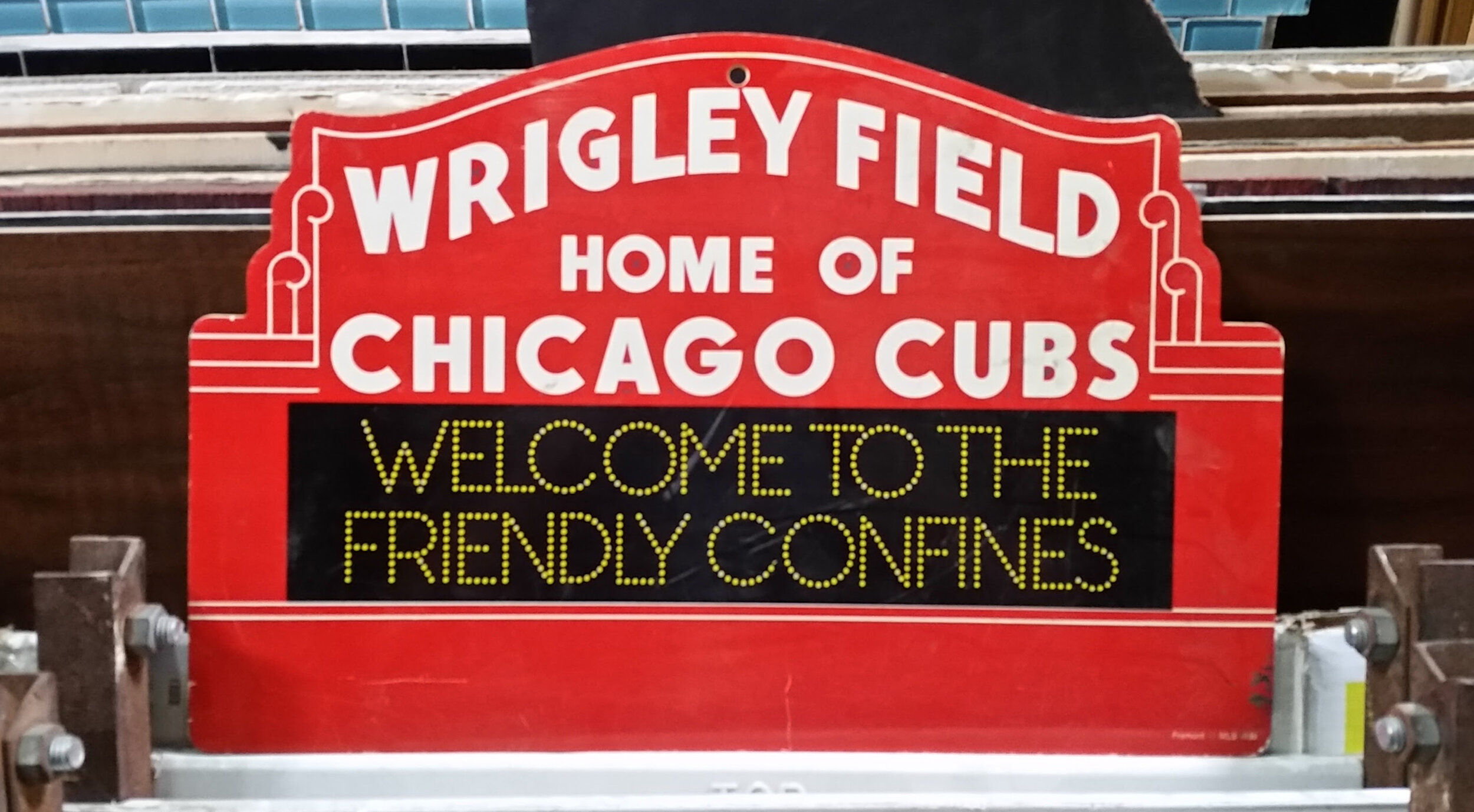 Wrigley Field Red Home of the Cubs Welcome to the Friendly Confines Sign.jpg