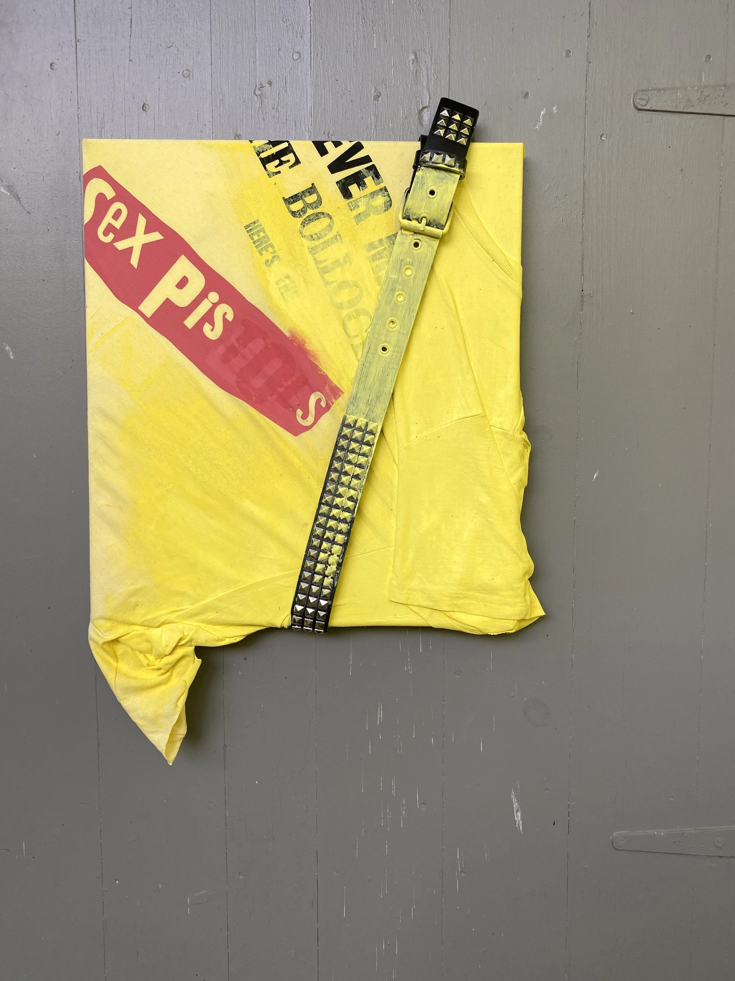 "Sex Piss". Acrylic on t shirt, studded belt. 2025