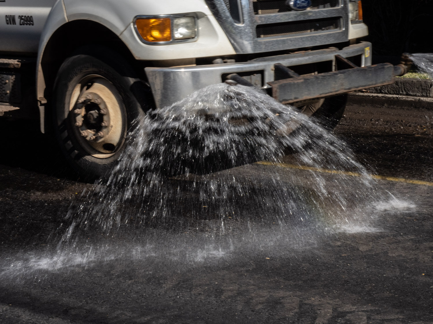 Water spraying truck for asphalt road repain in Manoa ©HowardWolff 20200227.jpg