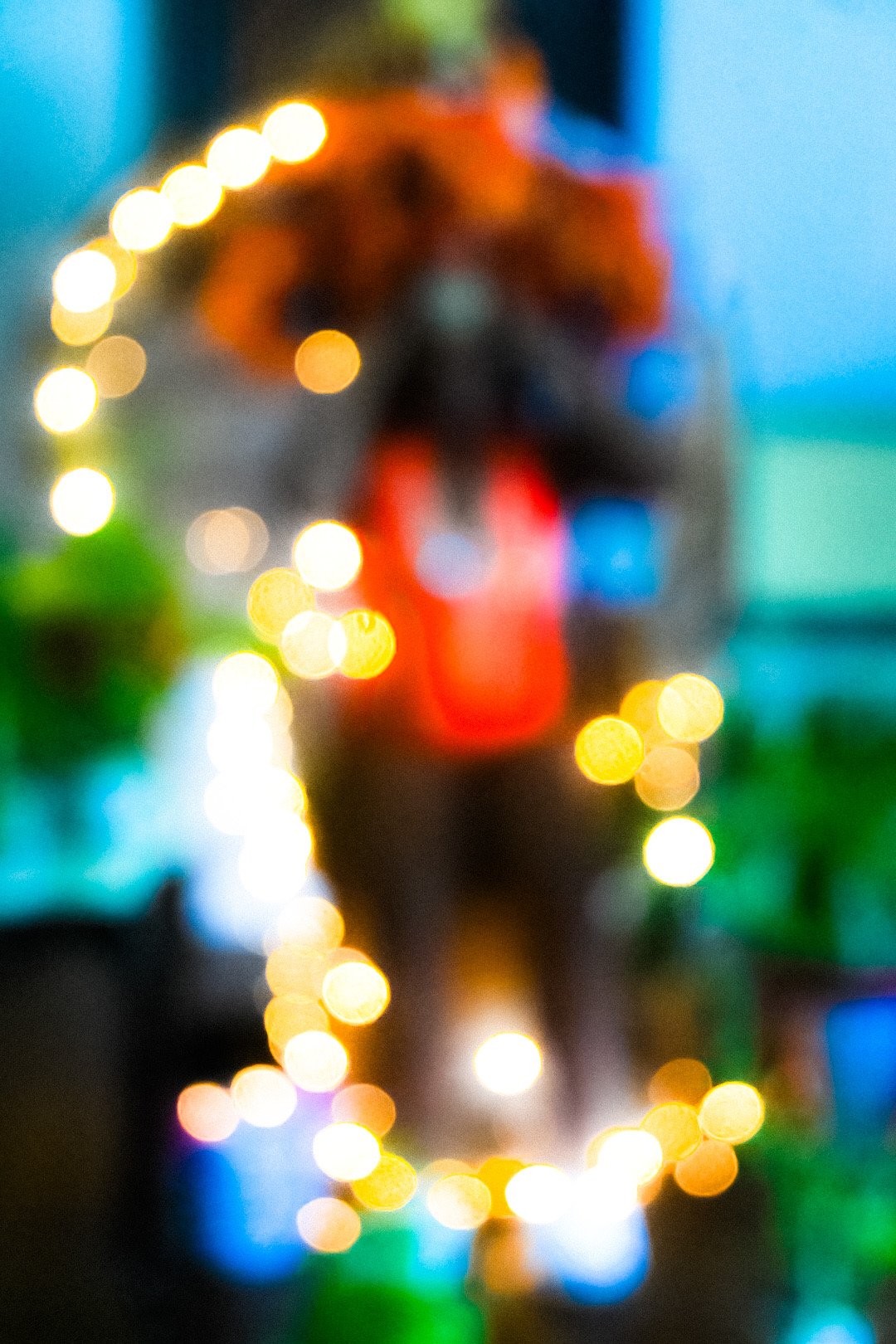 Abstract blurred image of a glowing figure with warm lights, symbolizing identity, energy, and the layered experience of Black Caribbean American existence.